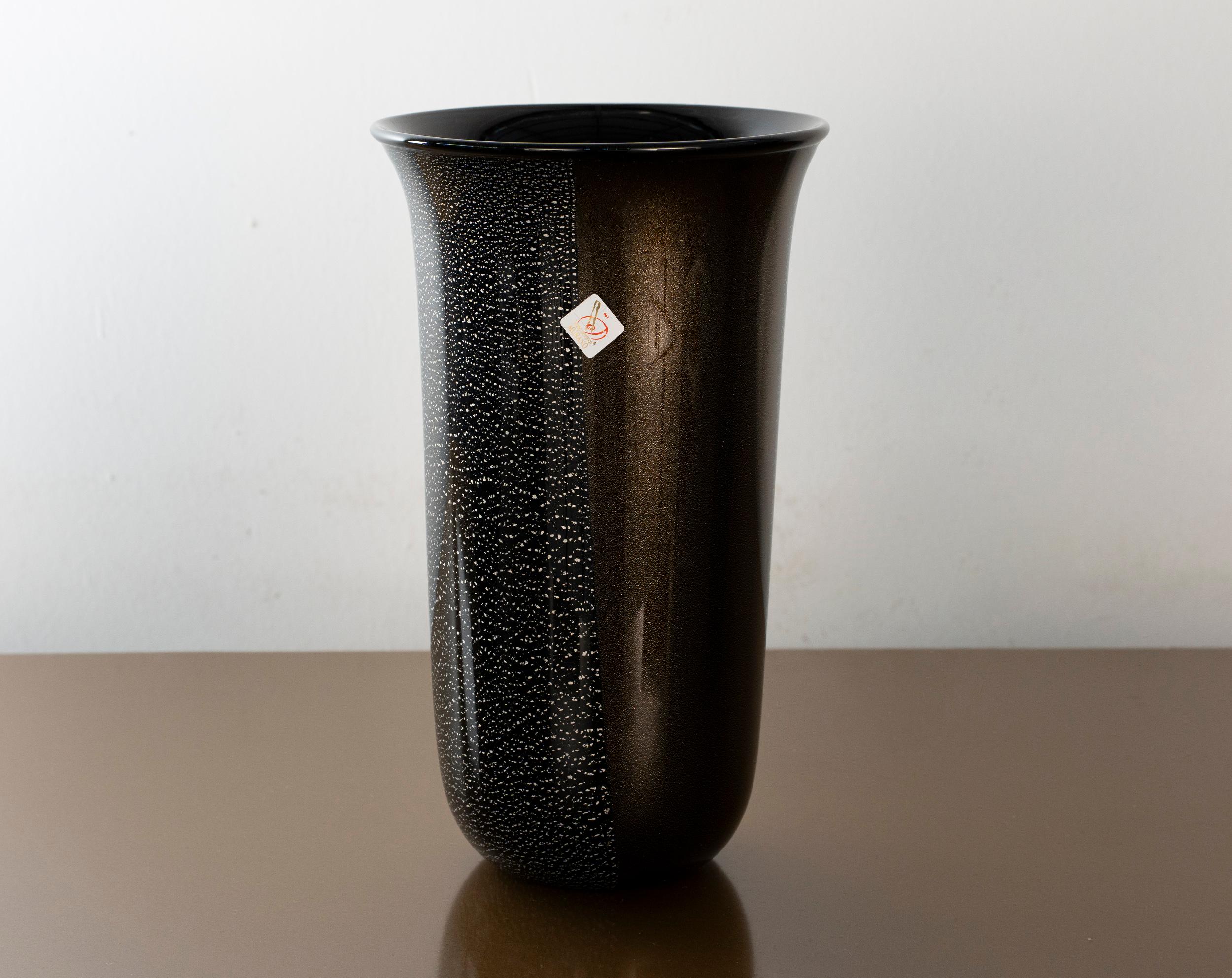 Unique Murano Black Glass Vase with Gold and Silver leaf details, early 2000s Italy
made on the island of Murano, near Venice, Italy, by the La Fornasotta factory. Still bears the original Vetro Artistico Murano (VAM) consortium label, with the