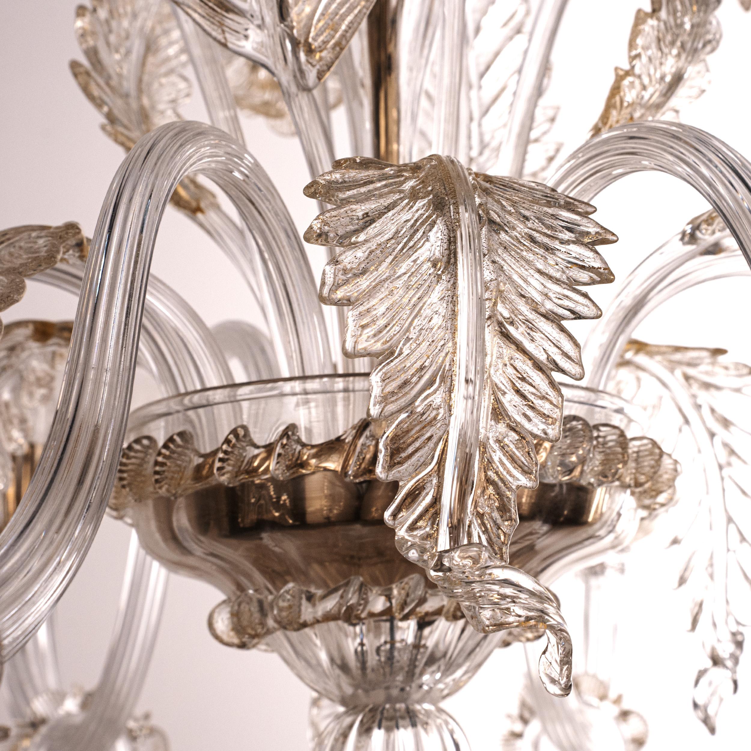 Unique Murano Clear and gold glass chandelier 6 lights, Vintage Made in Italy in stock.
Each detail is enriched with real gold, embedded in the glass during the blowing phase.
Condition: virtually perfect condition and never used: no heavy