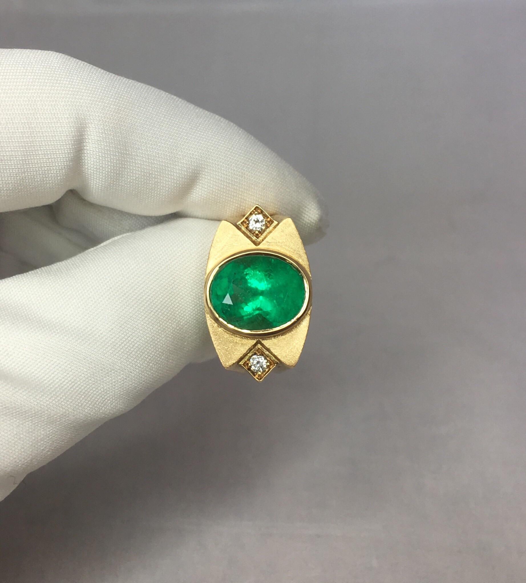 Fine natural vivid green Colombian emerald and diamond 18k gold ring.

Very unique style, custom made piece. High polished gold round the outside with a 'brushed gold' finish on top.

Bezel set with a large 5.75 carat stone with a bright vivid green