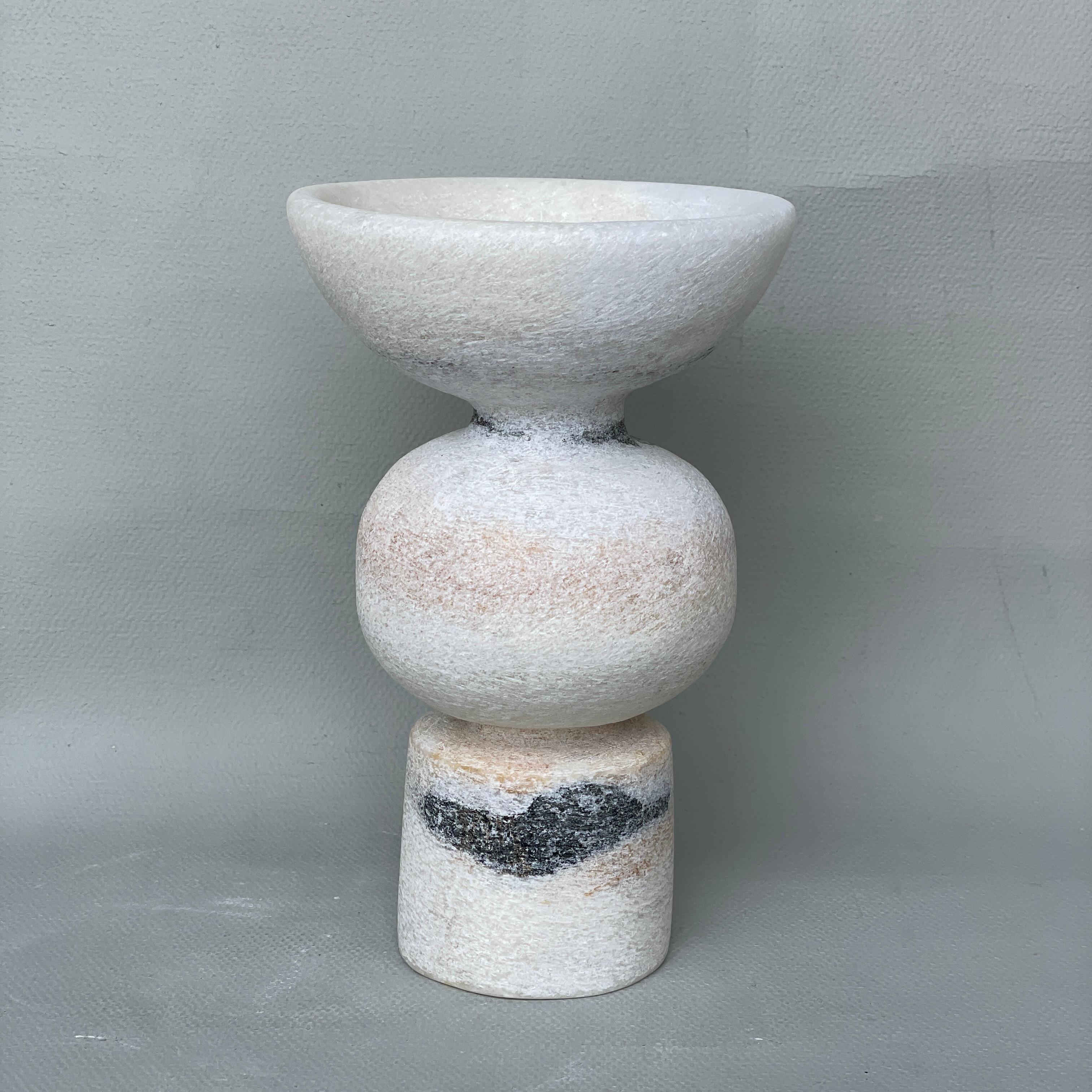 Unique Naxian Marble Vessel by Tom Von Kaenel
Unique piece.
Dimensions: Ø 12.5 x H 20 cm.
Materials: Naxian marble.

The surfaces of the objects are not sealed, they are not protected against acid. The lines of the handcraft are visible it