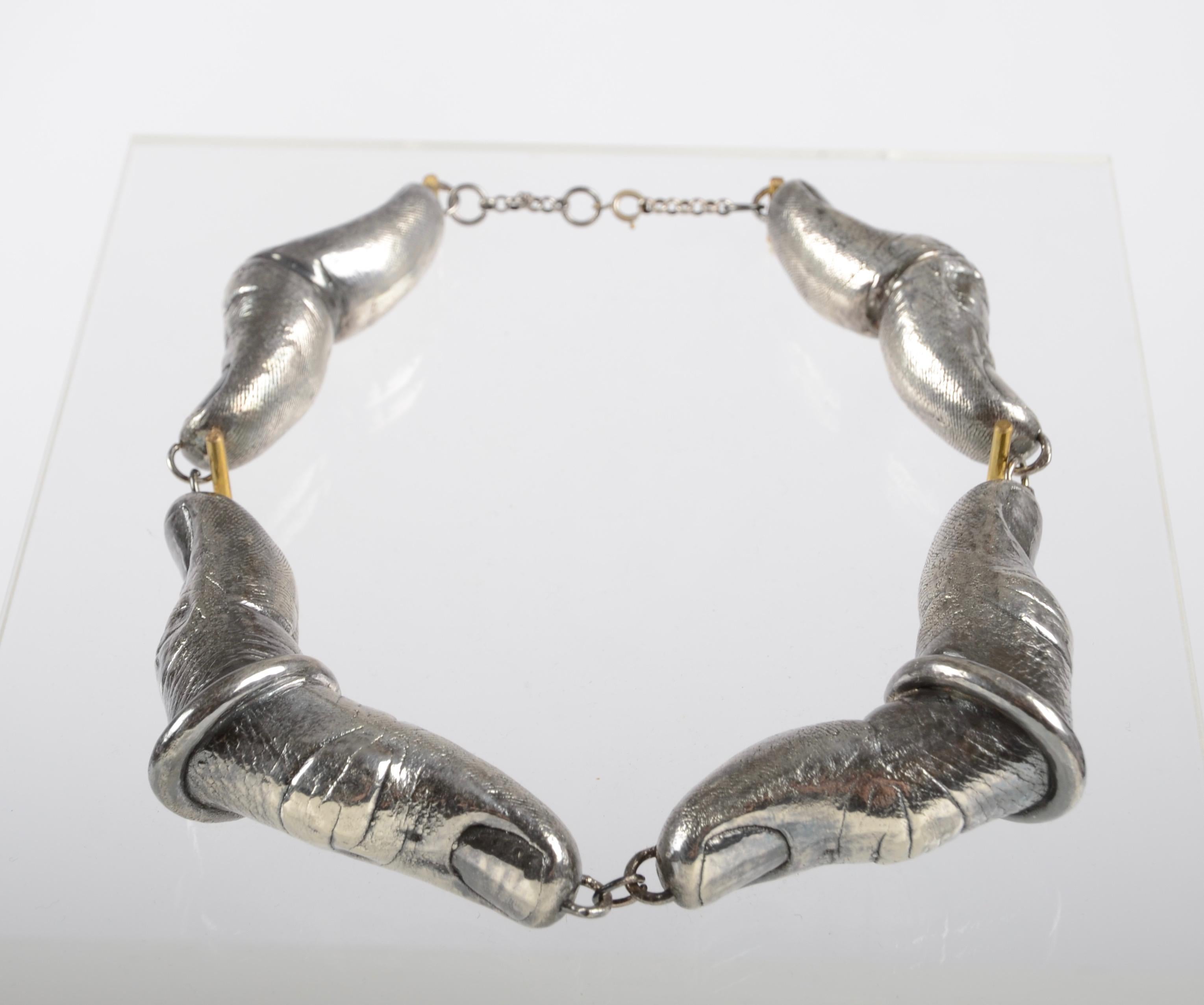 Unique necklet in silver, made in France, 1930s.

Apart of the exhibition “Essenzialmente la Mano”/ “Just the Hand”, seen in the catalogue edited by Alfonso Pluchinotta.