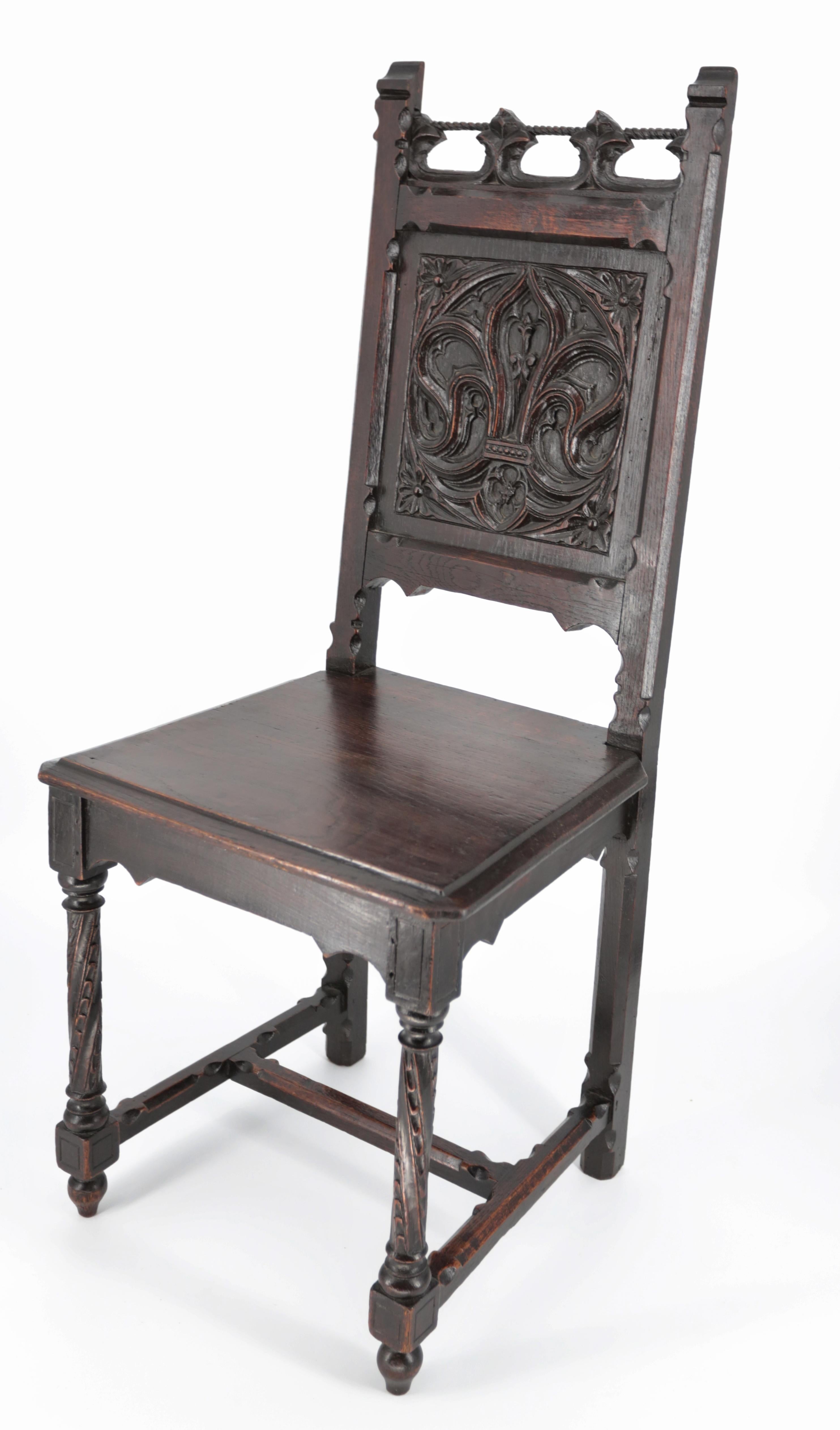Carved Unique neo-Gothic dining room, large table and 10 chairs For Sale