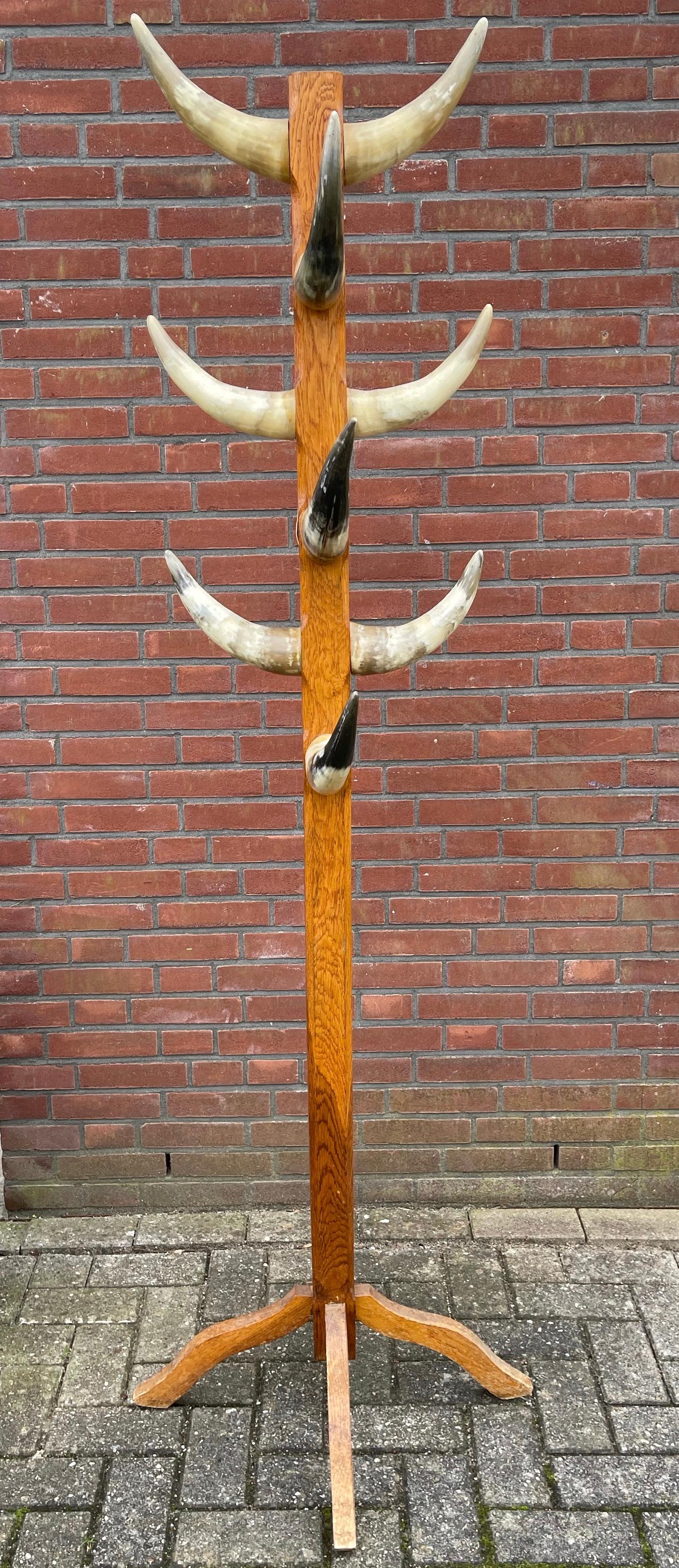 Antique and stunning, tree-like floor coat rack.

This unique and all handcrafted coat rack of substantial size and weight is another one of our recent great finds. If you happen to own a hunting cabin, a lodge a ranch or perhaps a steakhouse then