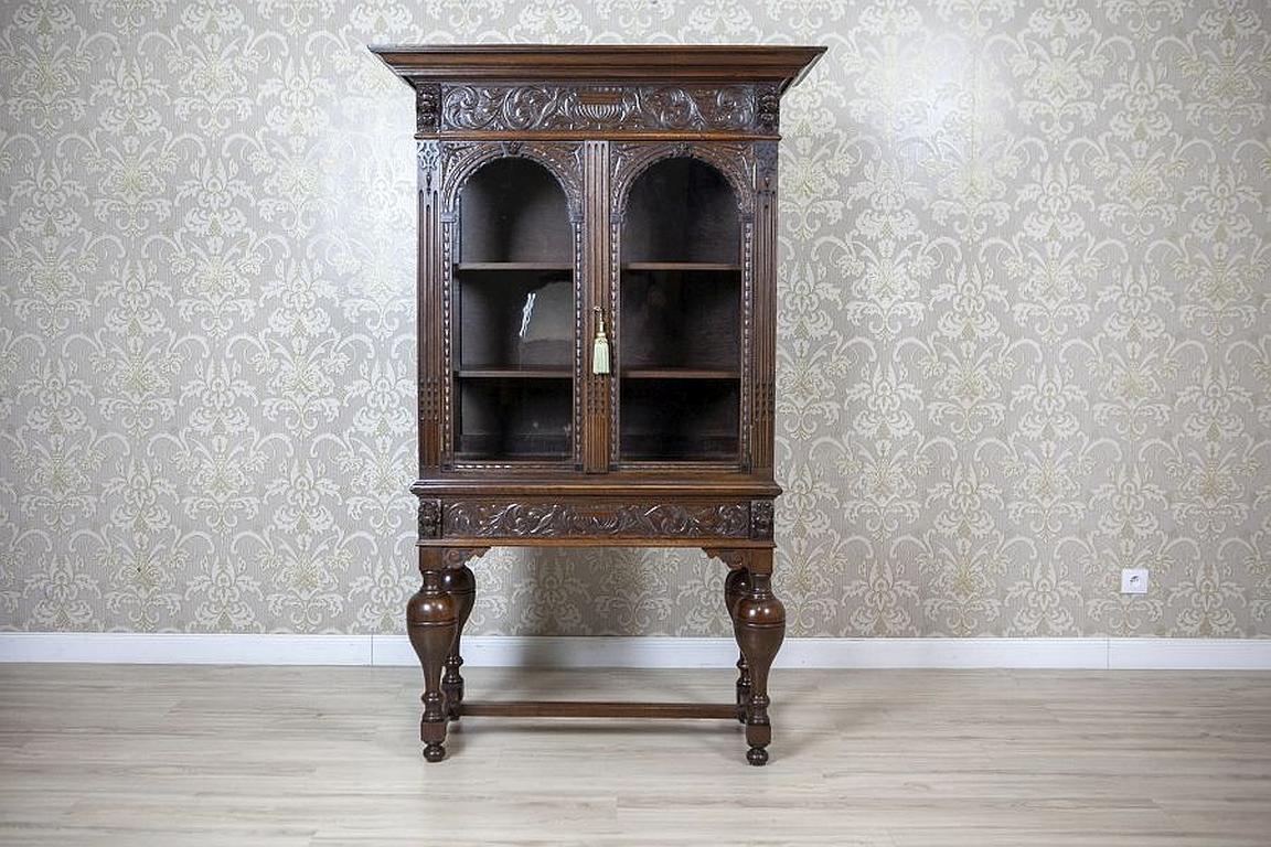 Unique Oak Showcase Richly Decorated with Carved Patterns, circa 1870

We present you an oak showcase from the 2nd half of the 19th century, made in Western Europe.
This two-door and elaborately carved piece of furniture has a highly advanced