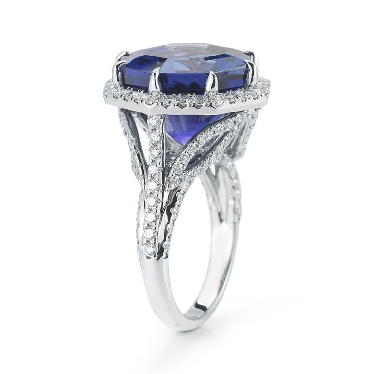 UNIQUE OCTAGON TANZANITE RING This truly unusual octagonal cut Tanzanite exhibits a depth of color and life unparalleled by other gems. Set in an airy diamond pave setting, emphasis is placed on the extraordinary nature of this center stone. Item: #
