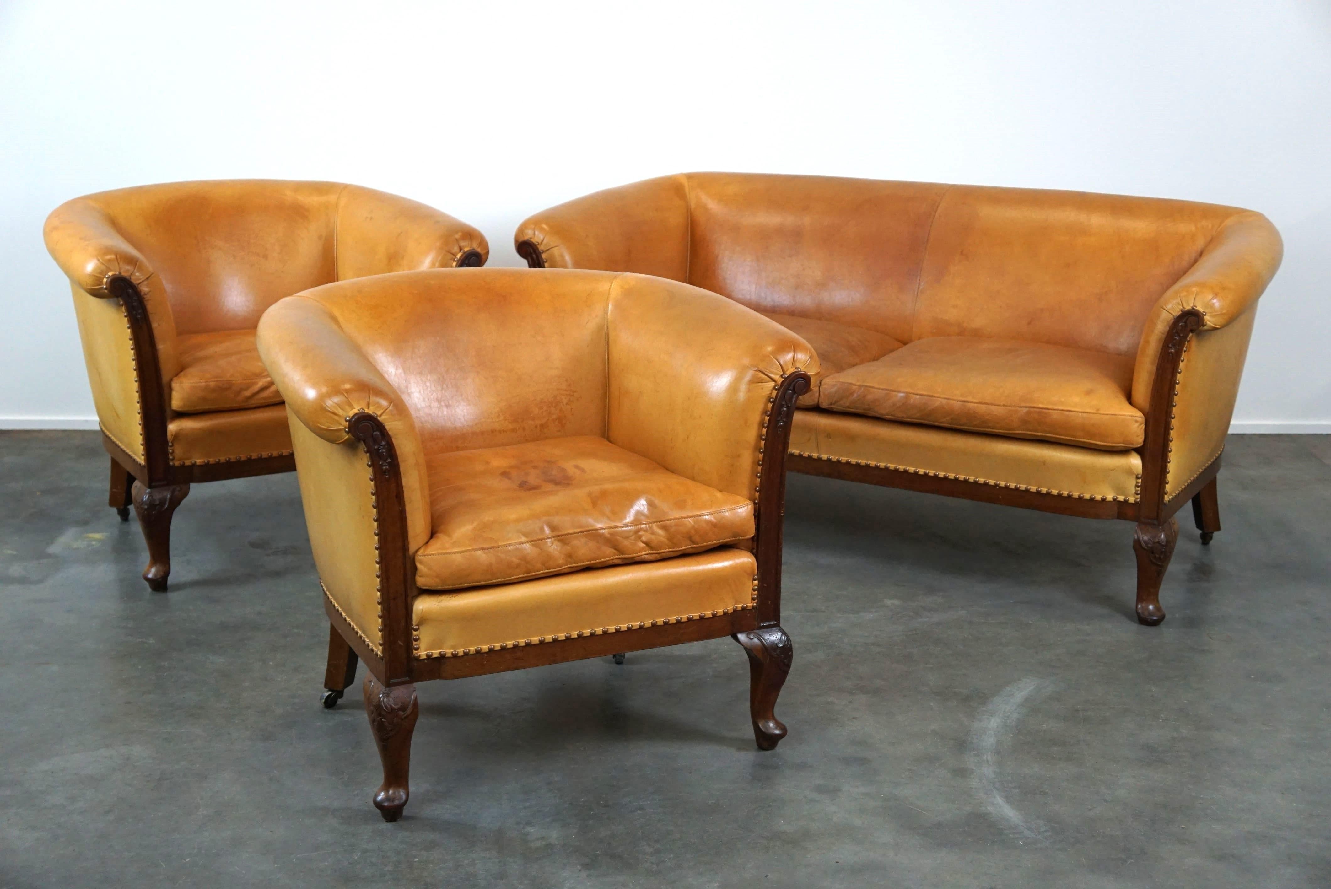 Unique old set of 2 club armchairs and a sofa in cognac-colored leather