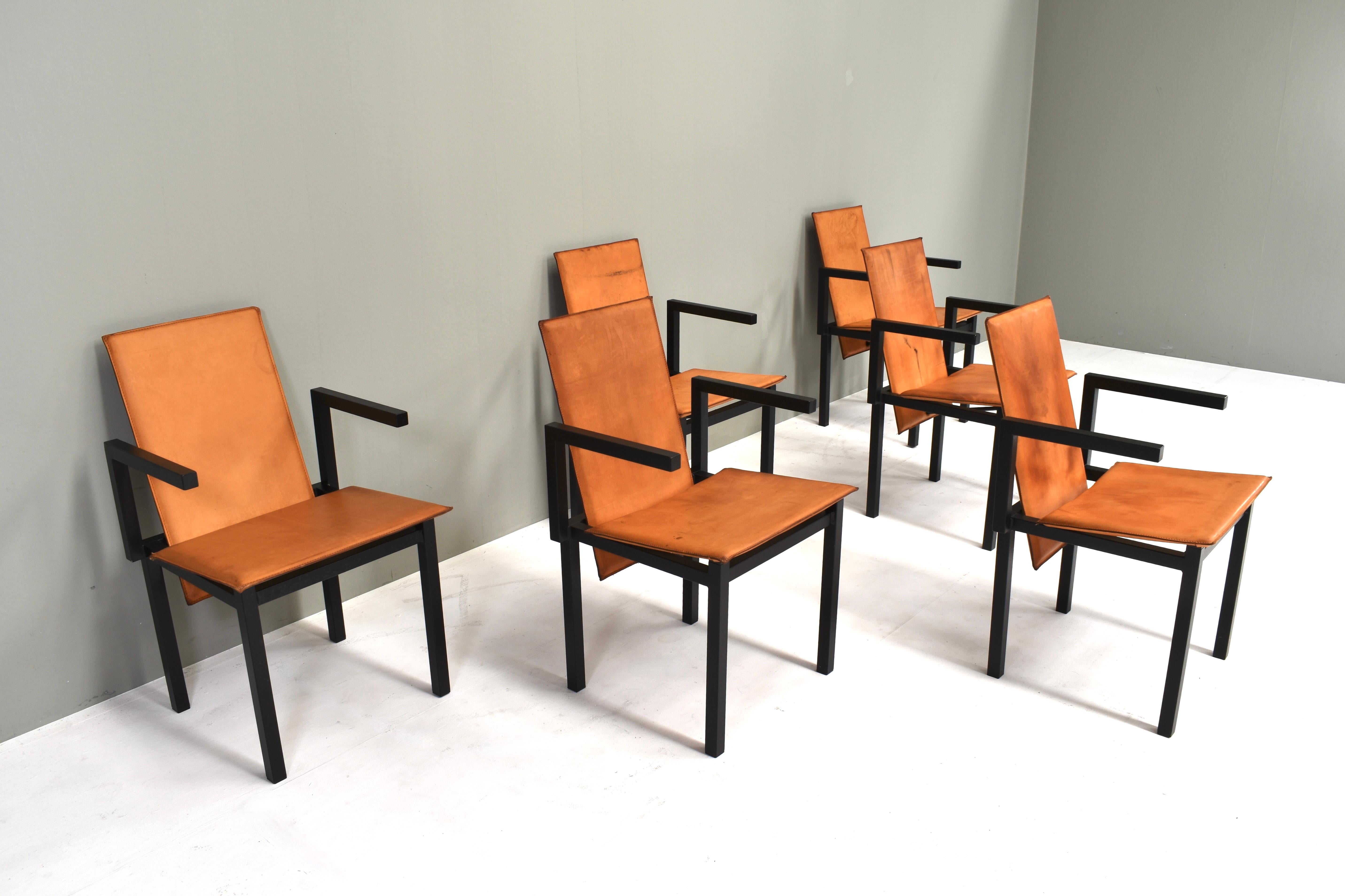Unique set of six minimalistic dining chairs in black coated metal and cognac leather. This is a one of a kind set custom made to order or as prototypes.
They come from a the Groninger Art Museum in Groningen, The Netherlands.
The angle of the backs