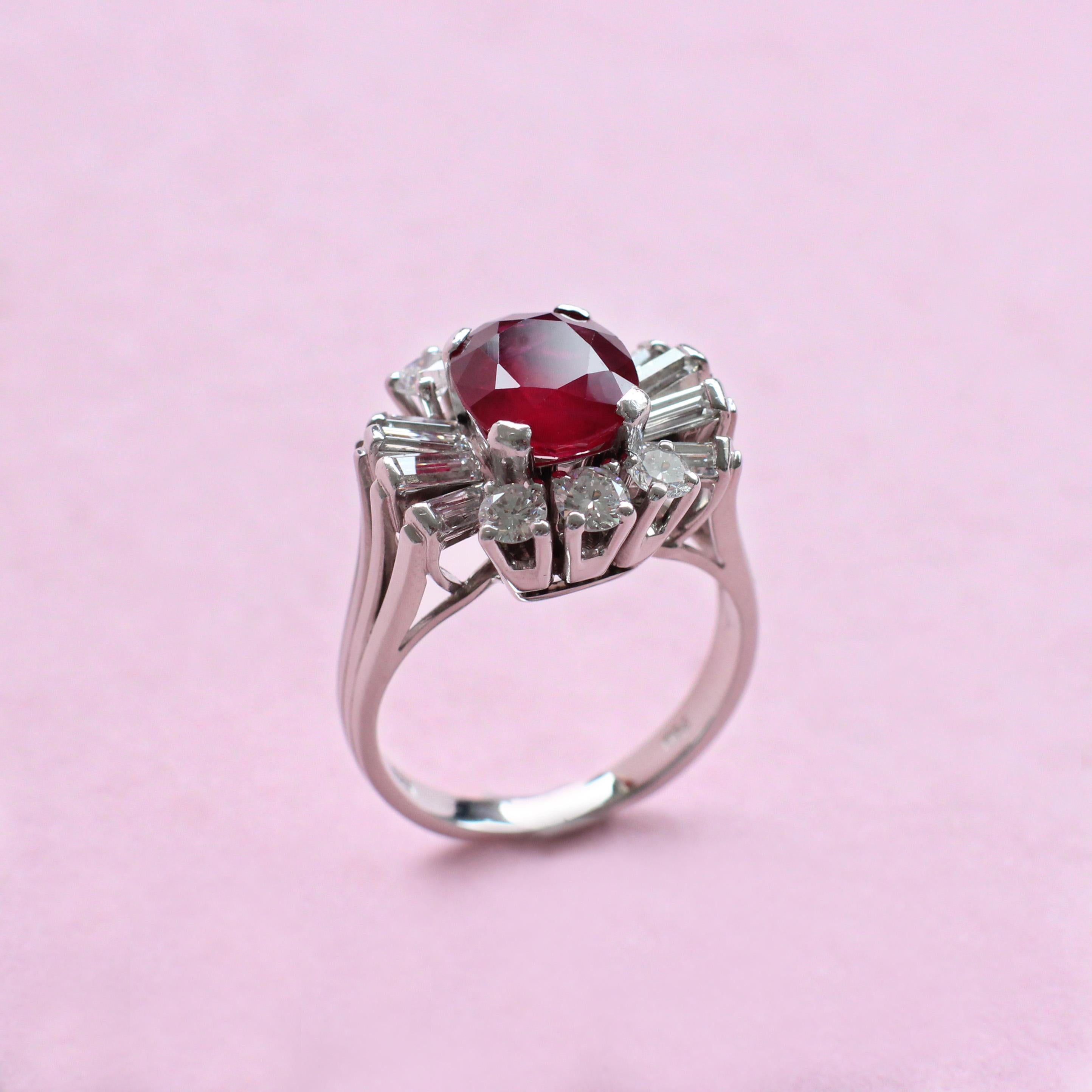 Contemporary Unique Oval Red Ruby Ring in White Gold with White Diamond Surround For Sale
