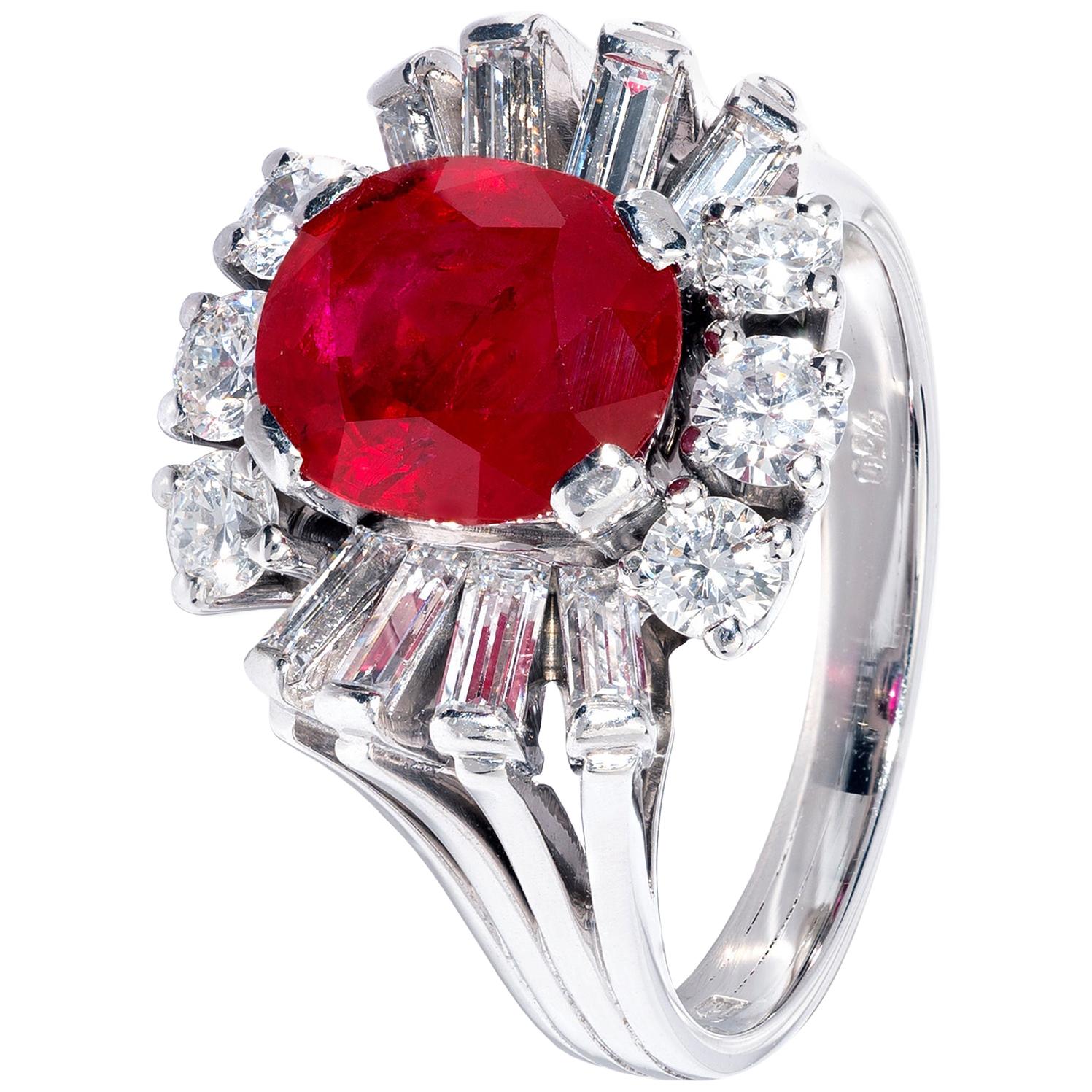 Unique Oval Red Ruby Ring in White Gold with White Diamond Surround For Sale