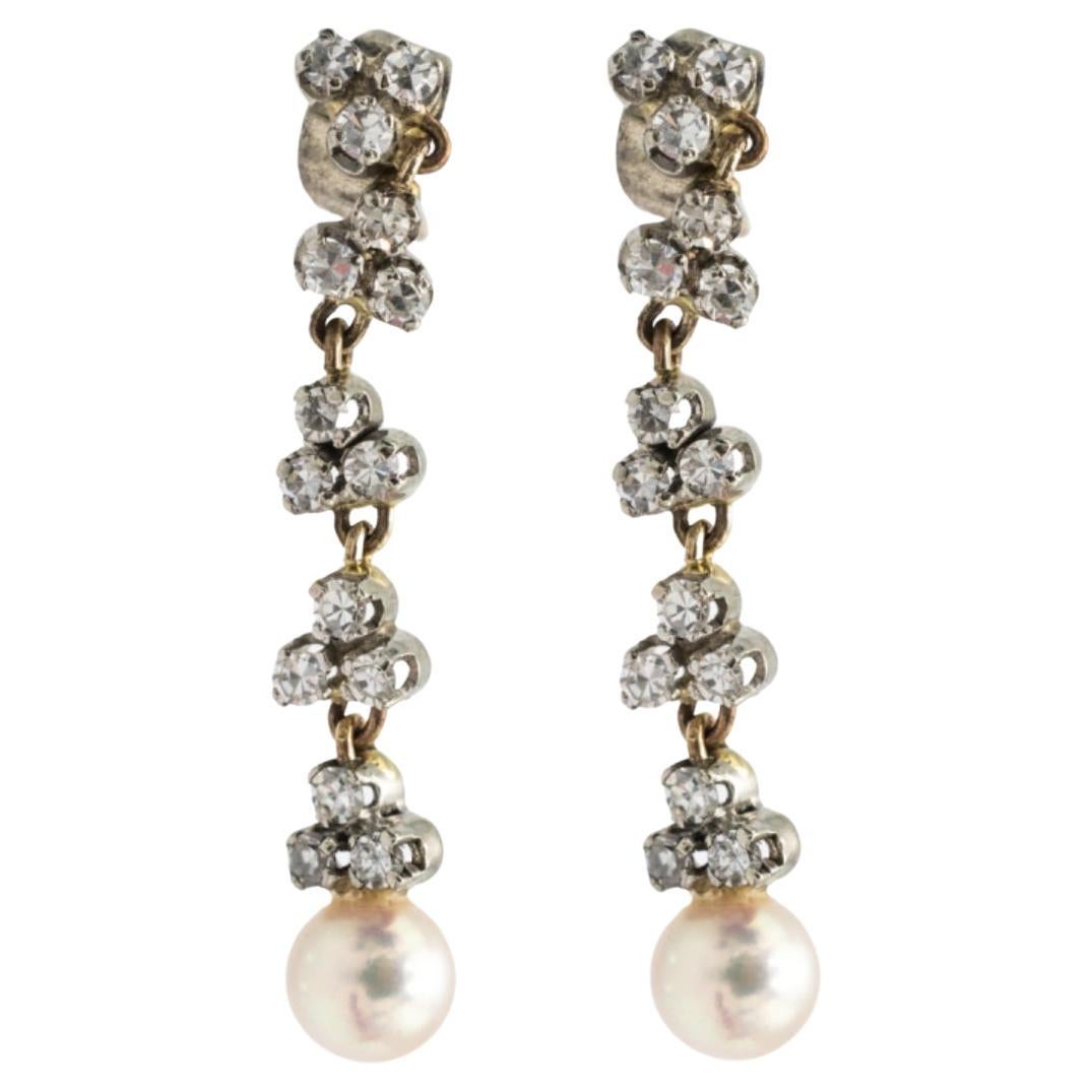 Unique pair of 14k white and yellow gold earrings with pearls and diamonds.