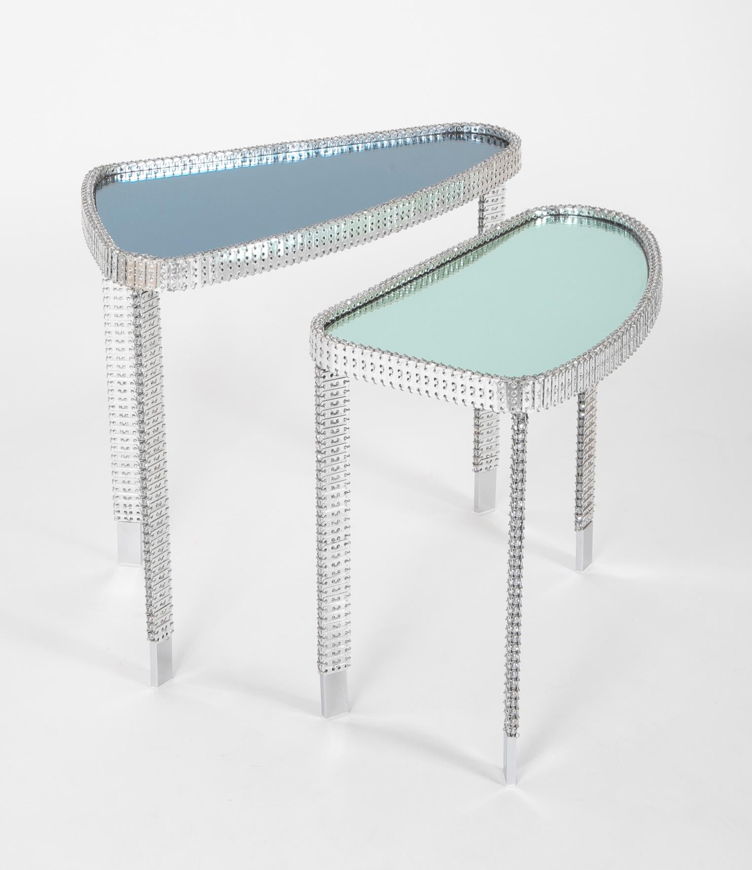 Unique pair of custom mirror top nesting tables by Philippe Montels with silver mesh trim set with Swarovski crystals. Circa 2016.

Measures: 1/ 20.5