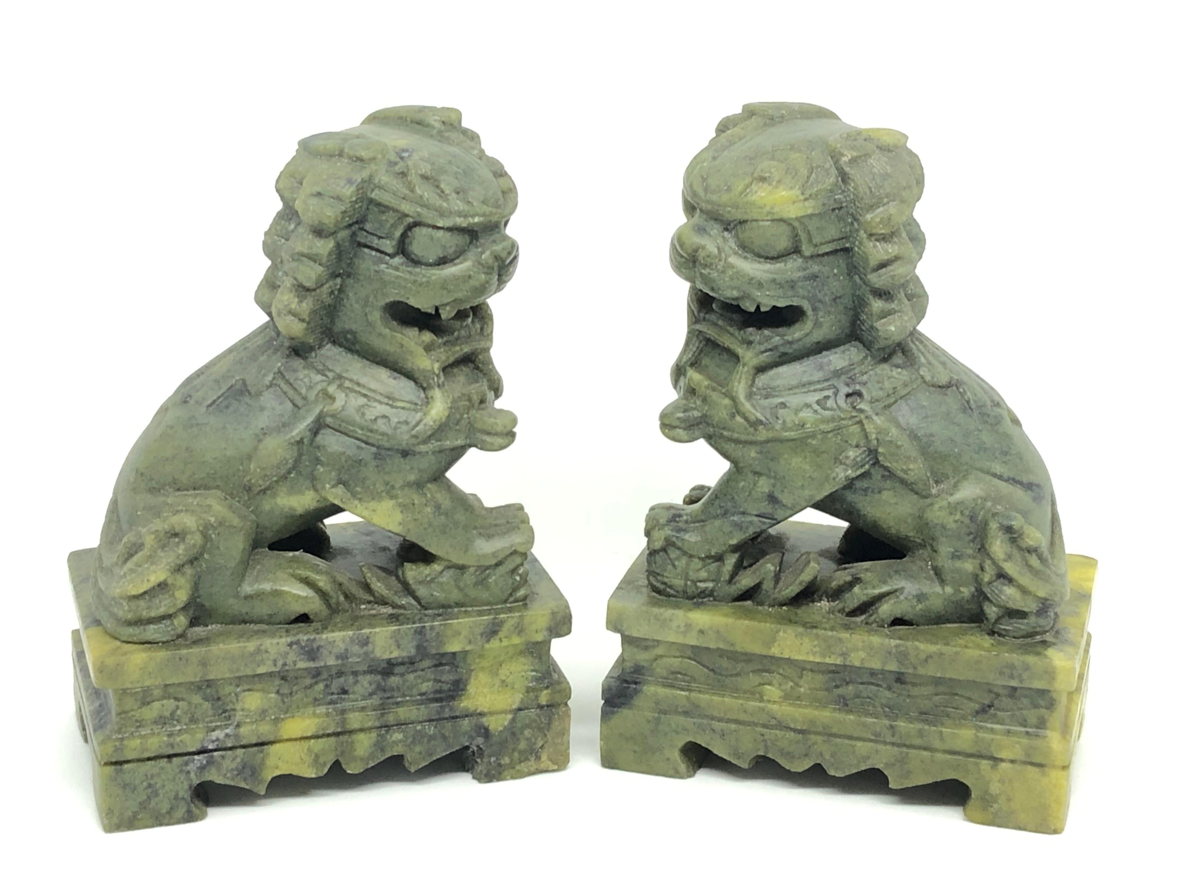 A pair of green colored marble foo dogs sculptures, book ends or decorative objects. Nice addition to any room.