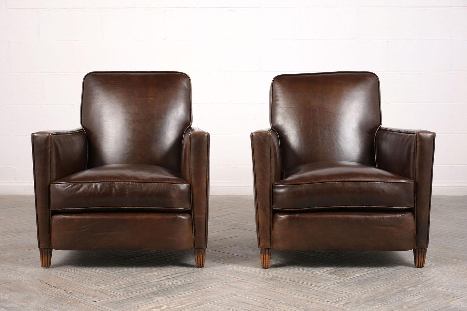 Elegant pair of 1930s Art Deco club chairs. They have been completely restored and professionally reupholstered in a dark brown leather. Has a single seat cushion with feather insert, making it very comfortable for hours on end. Also has single