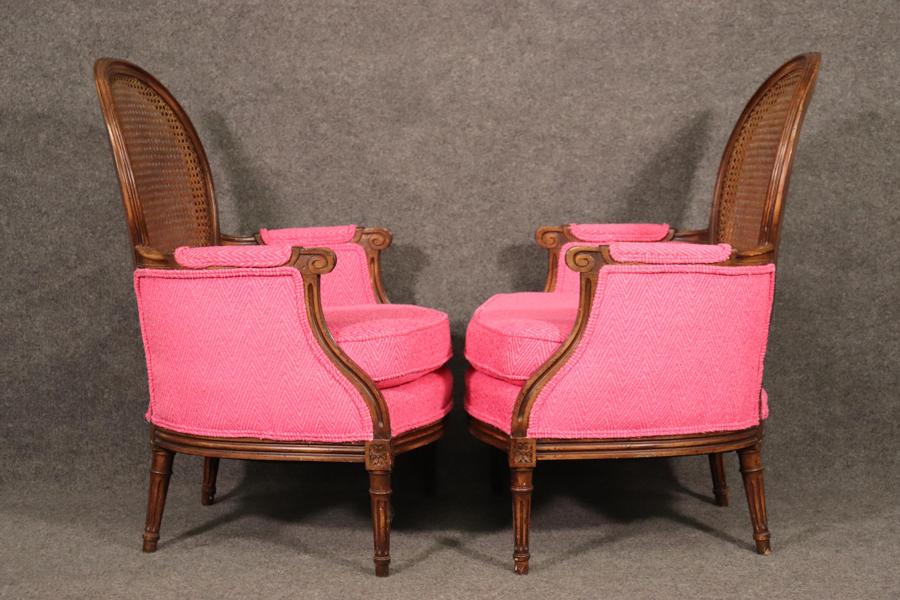 North American Unique Pair of French Louis XVI Style Walnut Cane Back Bergere Chairs Circa 1960