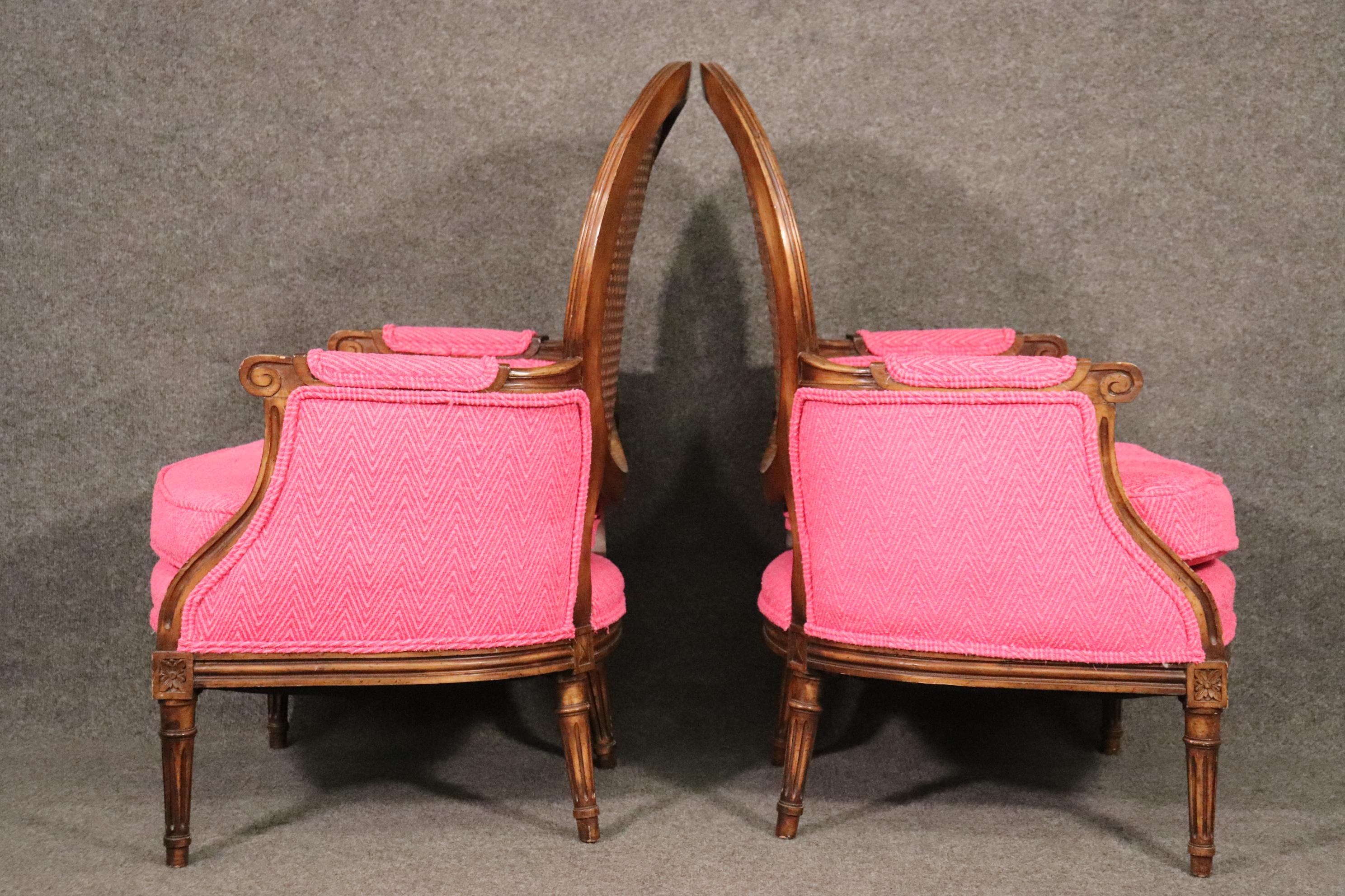 Unique Pair of French Louis XVI Style Walnut Cane Back Bergere Chairs Circa 1960 In Good Condition In Swedesboro, NJ