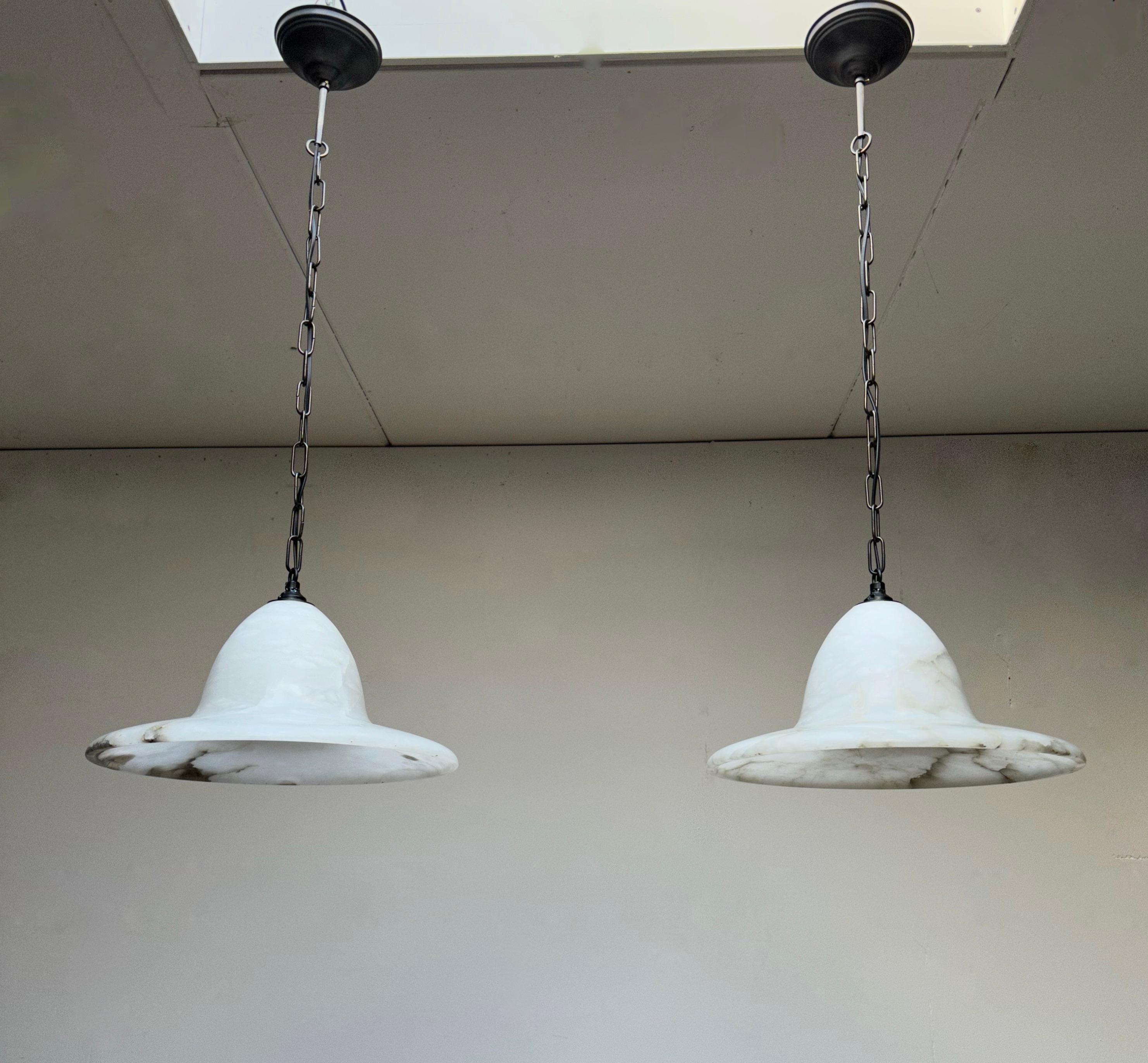 Rare set of hand carved, early 1900s alabaster pendant lights.

If you have been looking for the ideal pair of good size and stylish alabaster chandeliers for a project or for your own home then look no further. Via one of our connections we were