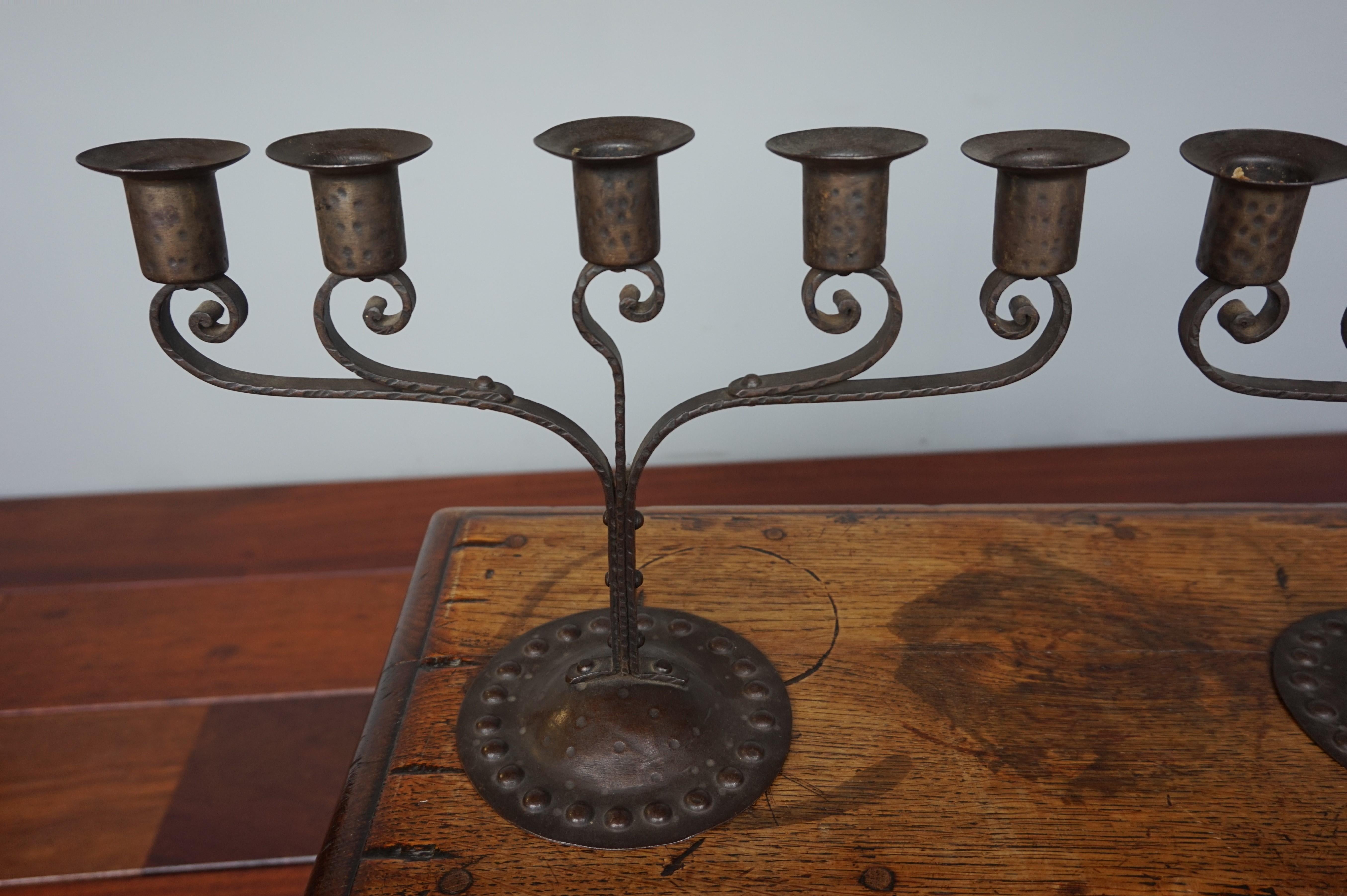 Antique and unique pair of handmade Arts & Crafts candleholders.

If you have an Arts & Crafts interior and you are looking for a pair of period table candelabras then this pair of five-in-line could be the perfect addition to your living space. All