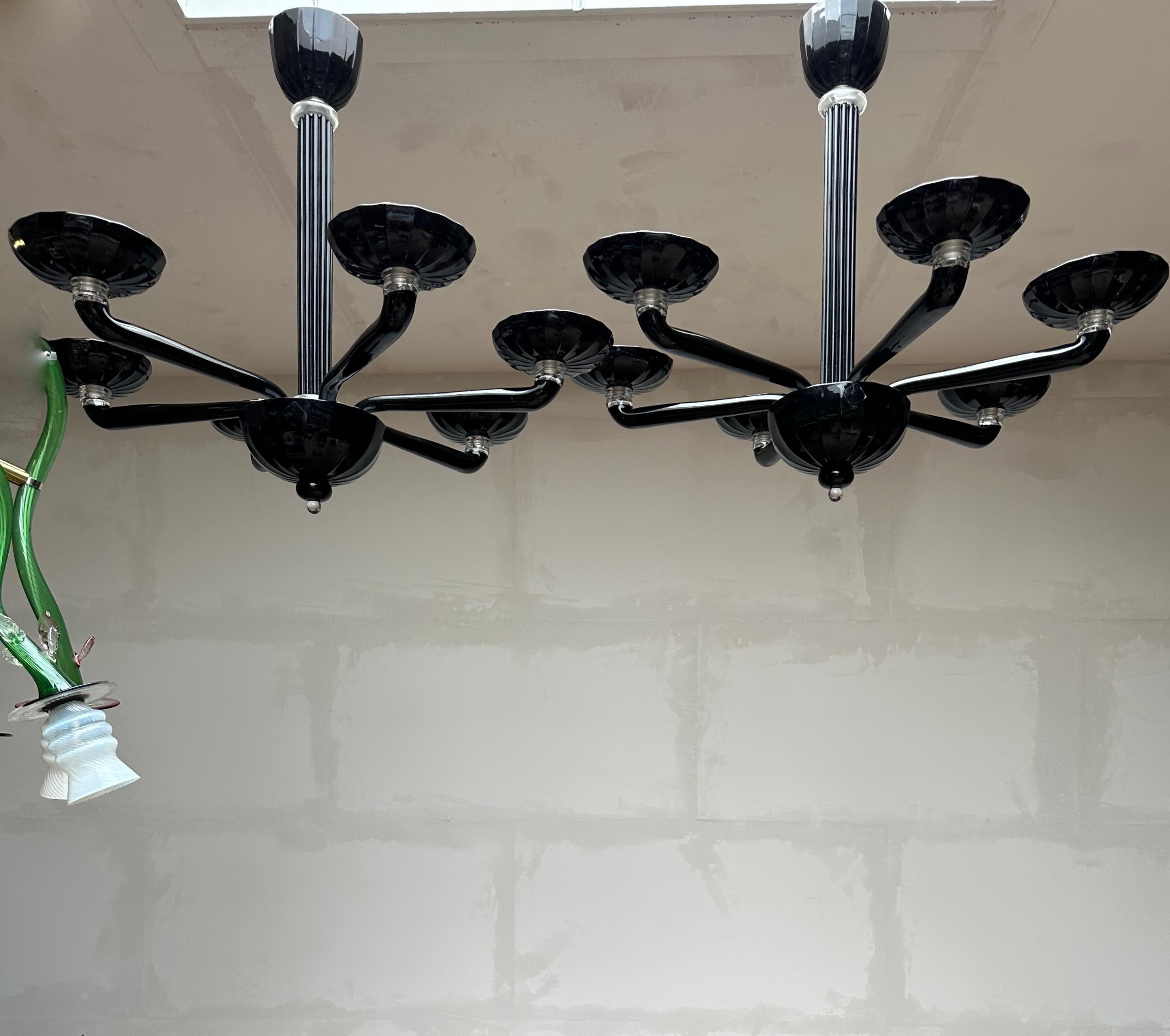 Wonderful, good size and mint condition pair of Venetian, black art glass pendant lights.

If you are looking for a rare and truly stylish pair of Murano art glass fixtures to grace your home then these handmade chandeliers could be perfect. With