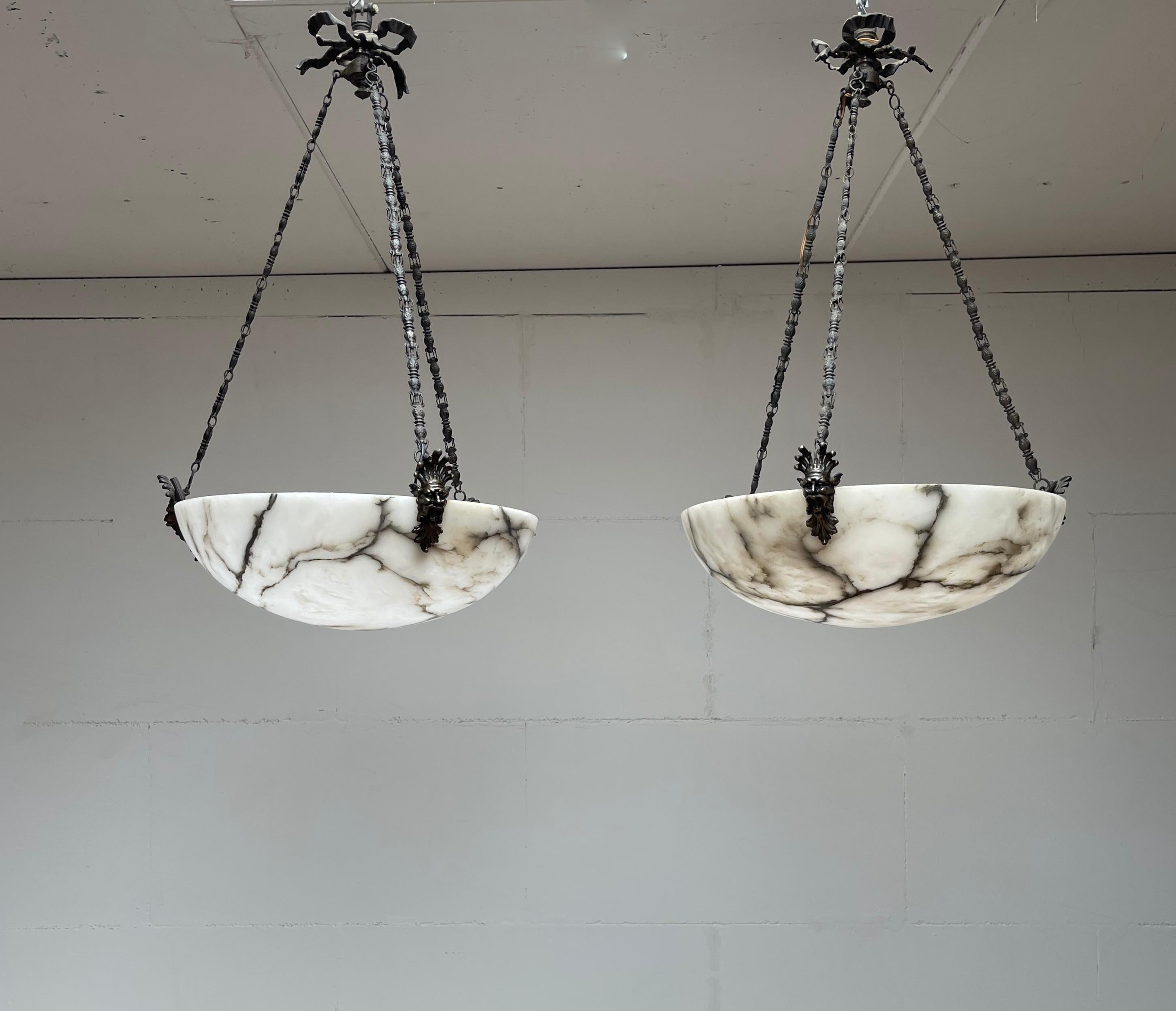 Extremely rare set of hand carved, early 1900s alabaster chandeliers.

If you have been looking for the ideal pair of large and stylish alabaster chandeliers for a project or for your own home then look no further. Via one of our trusted connections