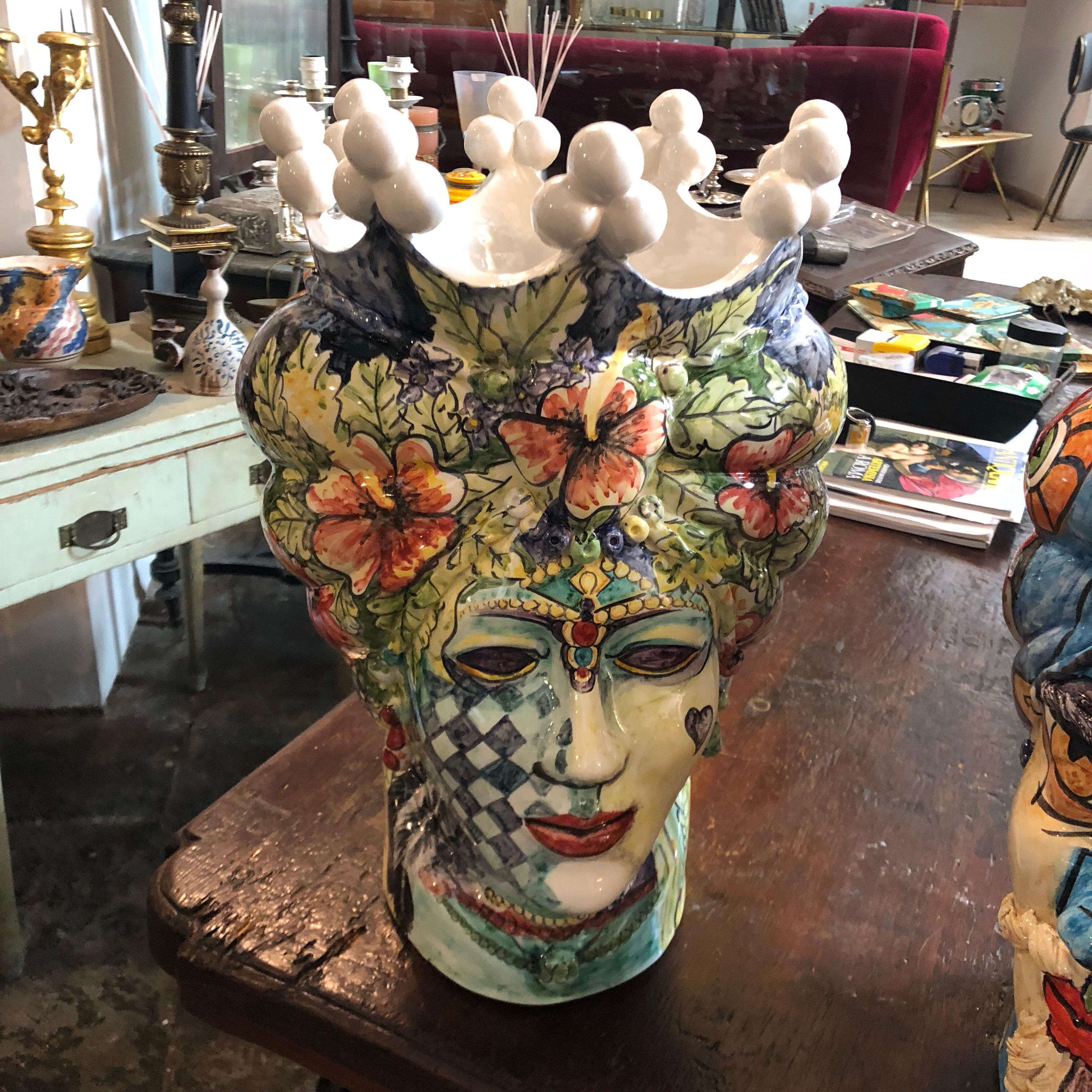 It's an amazing pair of white clay Sicilian Moro's head vases, interpreted in a Pop Art style by a Sicilian young painter and signed 1/1 MR on the base. There are no copies of these, they are unique pieces. The legend of the Sicilian Moro's heads