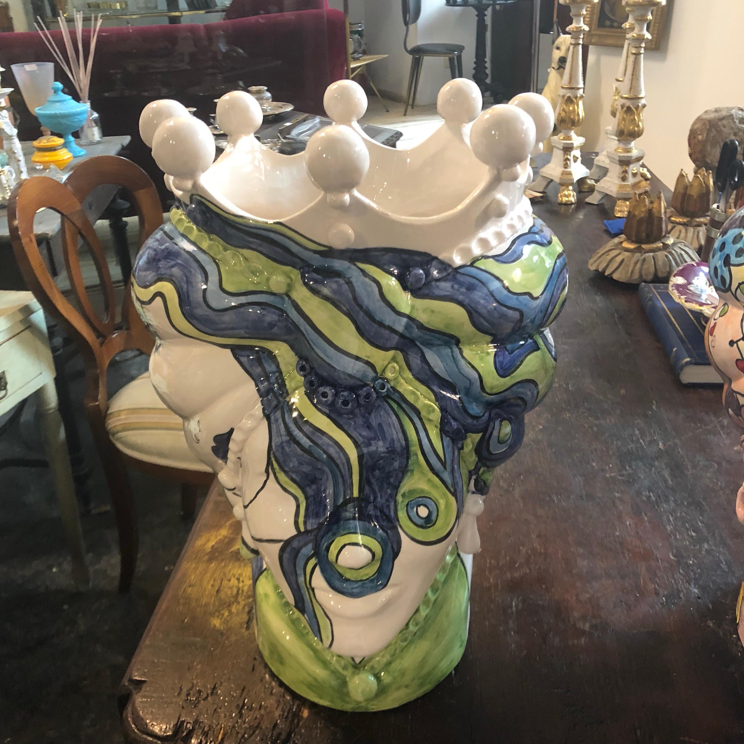 It's an amazing pair of white clay Sicilian Moro's head vases, interpreted in a pop art style by a Sicilian young painter, signed 1/1 MR on the base. There are no copies of these, they are unique pieces. The legend of the Sicilian Moro's heads