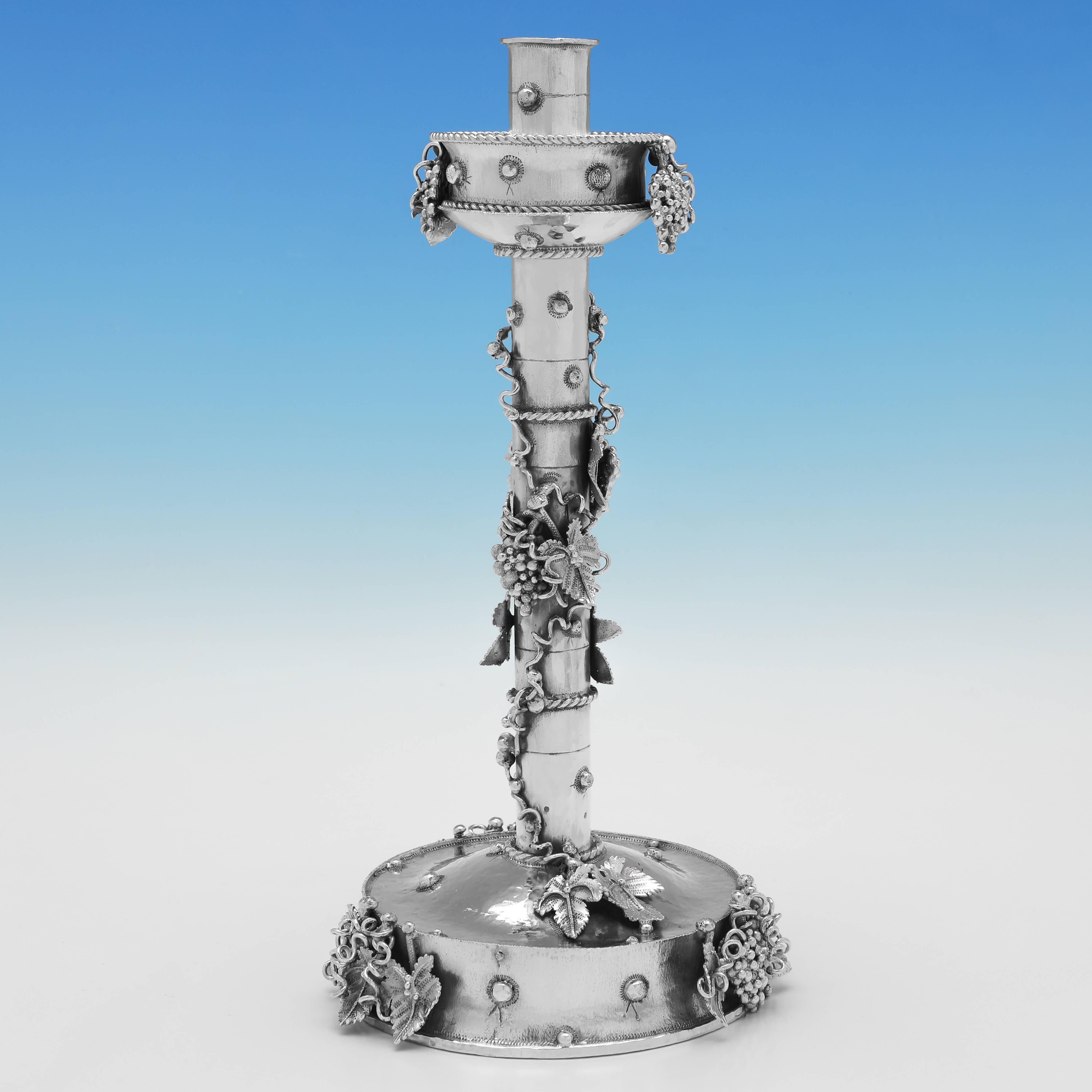 Hallmarked in London in 1996 by Michael Allen Bolton, this incredible pair of Sterling Silver Candlesticks, are in the Gothic Revival Style Michael was known for, and are wonderfully designed to look like vines have grown up the candlesticks. 

Each