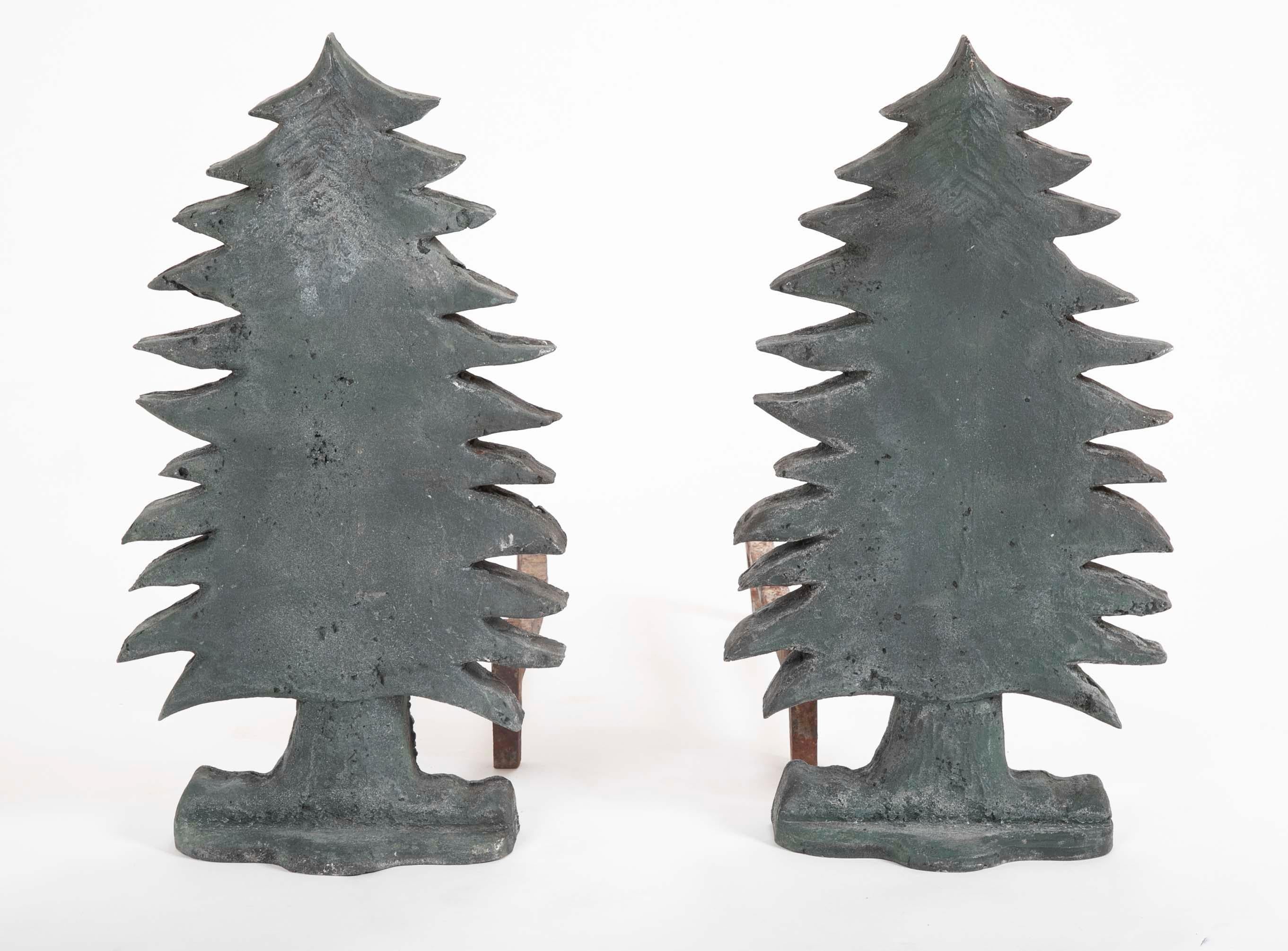 Unusual, if not unique pair of vintage evergreen tree form puddle cast iron andirons with old green paint. Wonderful folksy feel. From great home in New Hampshire, circa 1920s-1930s.