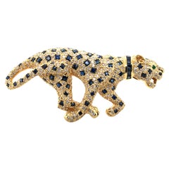 Vintage Unique Panther Brooch with Sapphires and Diamonds in 18 Karat Yellow Gold