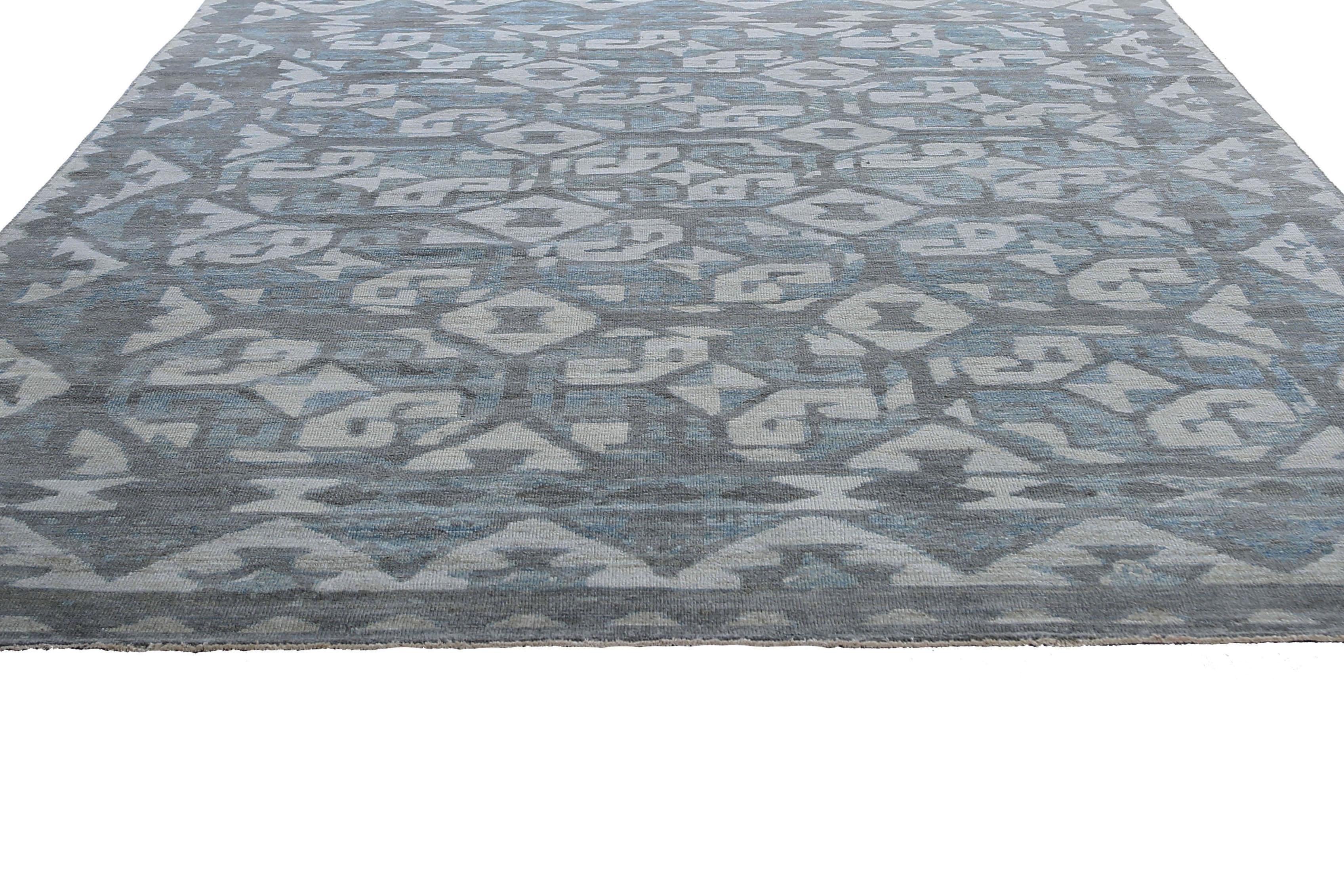 Add a touch of elegance to your home with our Turkish Sultanabad rug featuring a unique pattern in blue, grey, and cream colors. Crafted in the traditional style of the Sultanabad region in Turkey, this rug is made from high-quality wool, ensuring