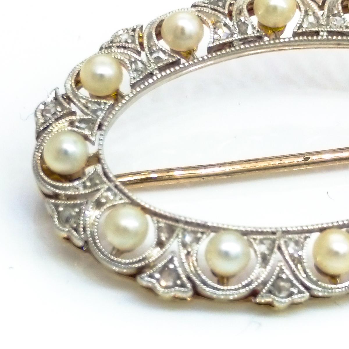 Hand made oval brooch measuring 34 mm x 22 mm
Set in Platinum and 18 carat Yellow Gold
With 12 pearls 2.7 mm in diameter and encrusted with 36 Rose-cut diamonds
Art Nouveau, circa 1920-s
Total weight of the brooch is 4.88 grams