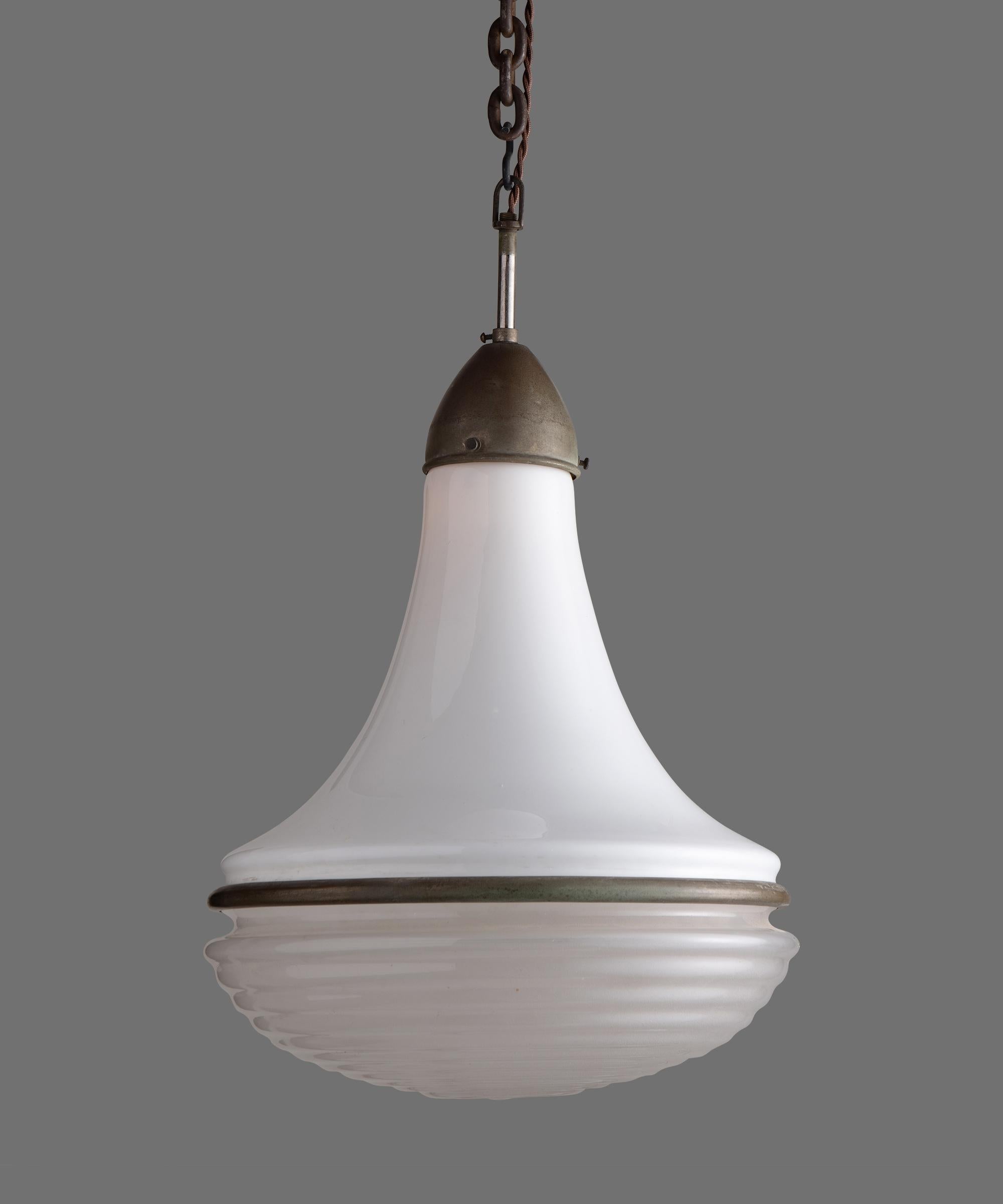 Unique pendant by Siemens, circa 1930.

White glass upper with ribbed, etched glass lower and patinated steel clasp.

Measures: 12.25” diameter x 17” height (to top of fitter).