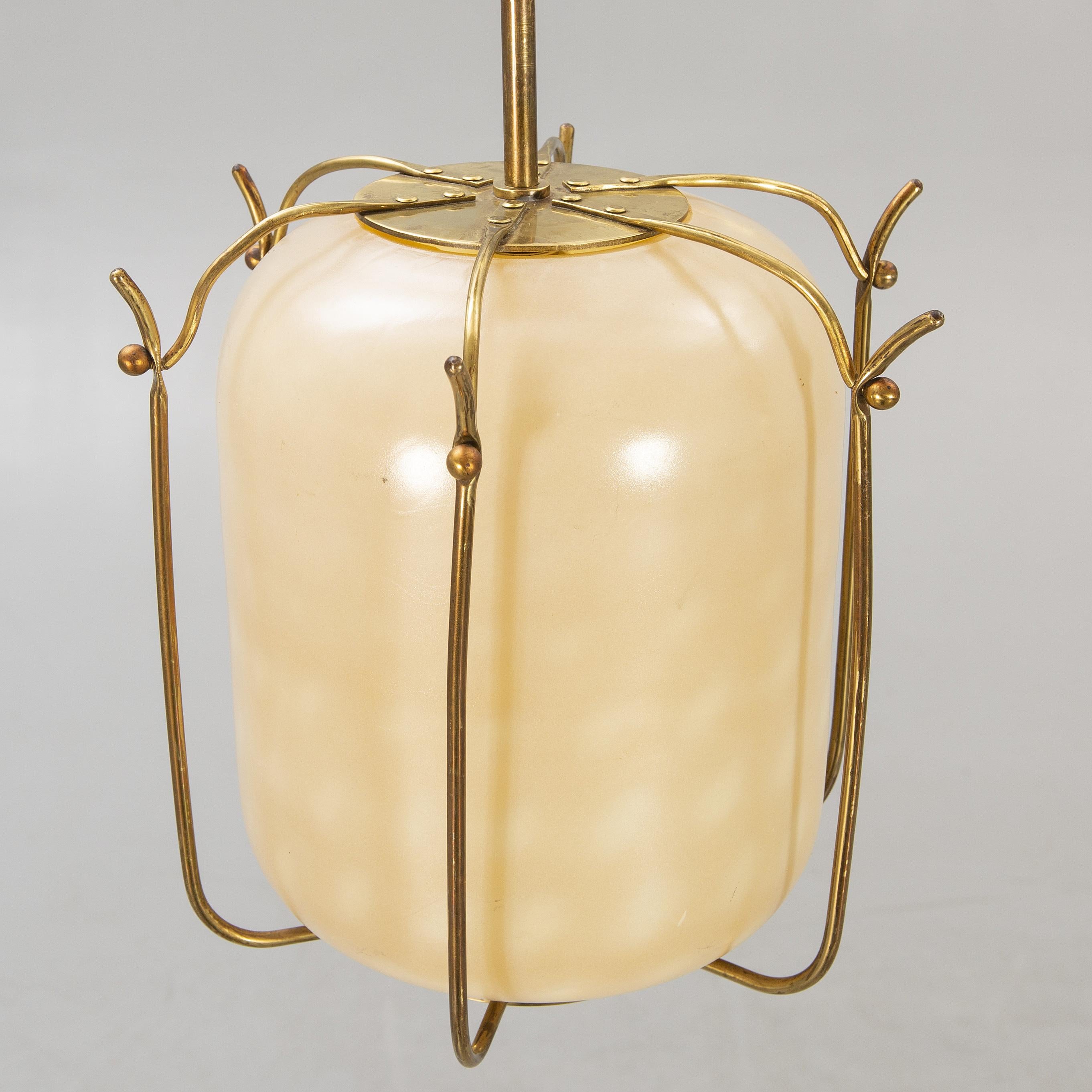 Unique pendant light anonymous work in the style of  James Mont glass and brass USA 1960
one of a kind pendant lamp, opalin glass and brass.
Good condition.