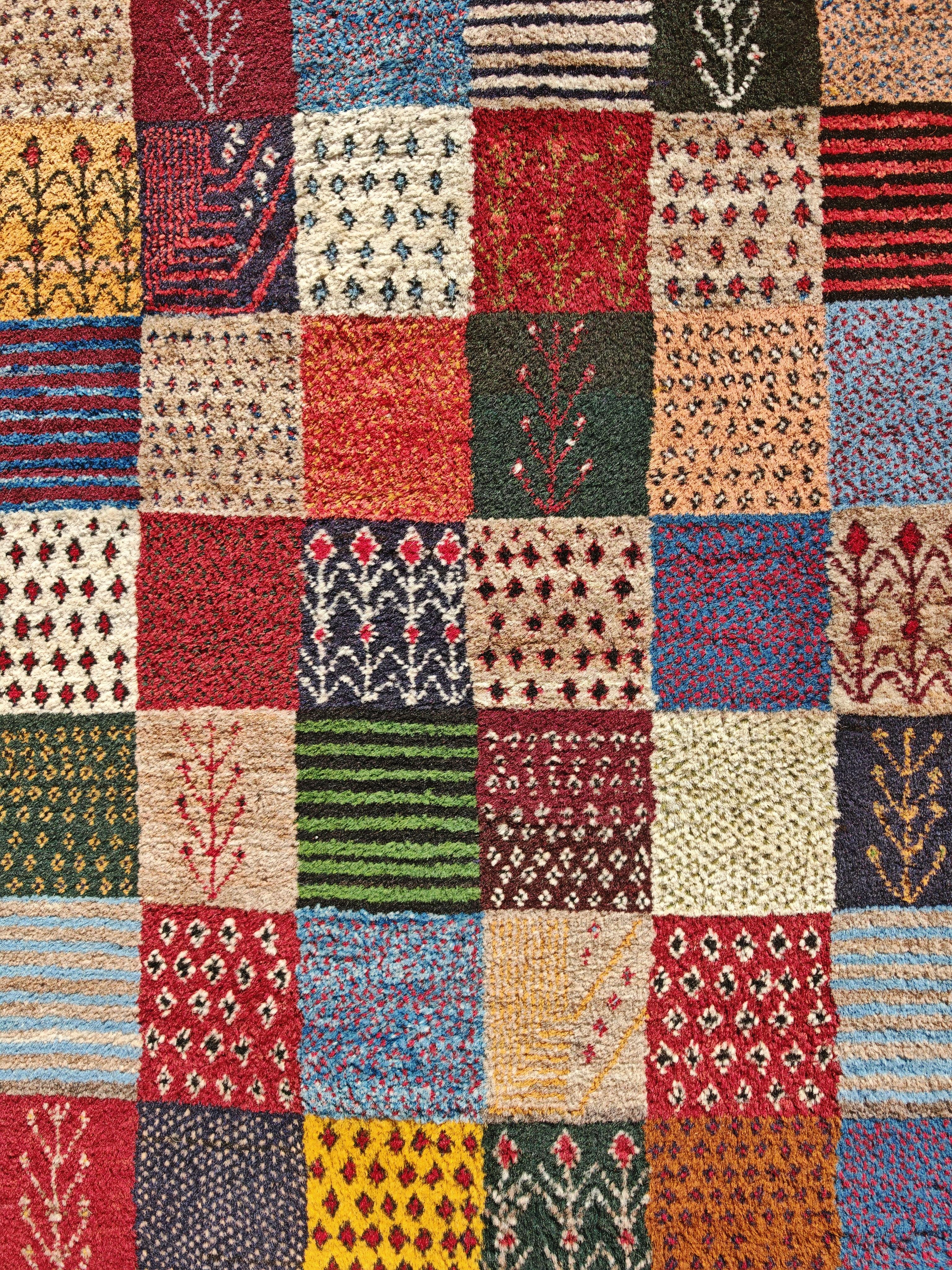 Tribal Unique Persian Gabbeh Runner with geometric and floral pattern, Iran 1990s For Sale