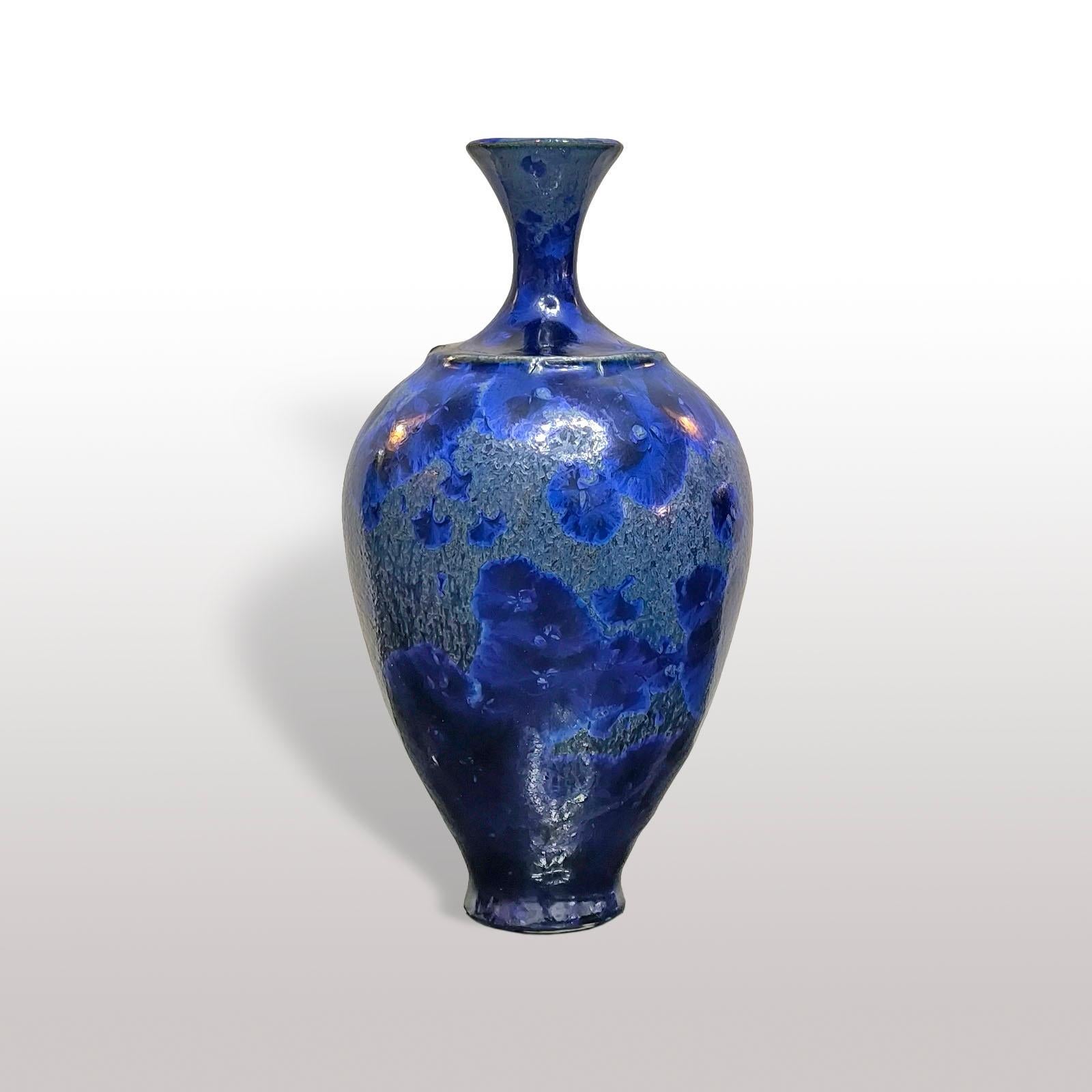 Isak Isaksson Ceramic Vase with Crystalline Glaze, Sweden 1980s.
Unique piece, stoneware vase with blue crystalline glaze. 
Flowers and branches cut on the neckin in a sophisticated and original decoration.
A subtle overlay of volumes and shades of