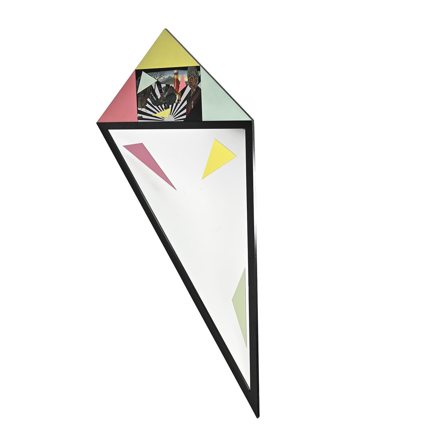 A unique piece, a very large triangular mirror by Swiss artist Mario Eichmann.

The lozenge-shaped frame is partially painted with a surrealist decoration. 

Created for the 