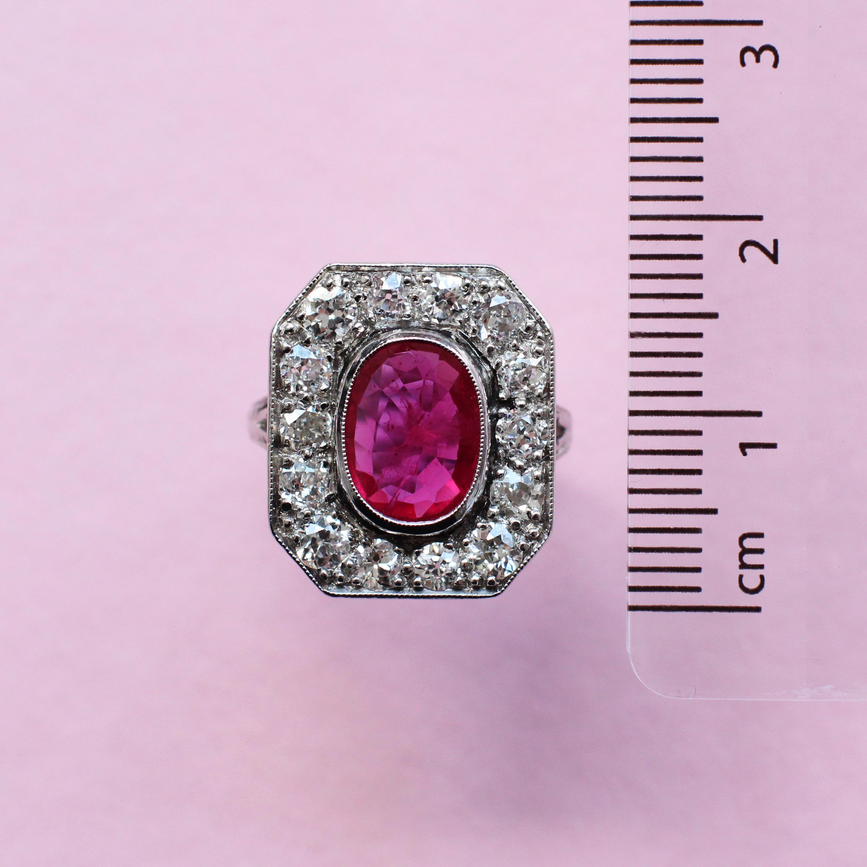The mesmerising octagon ruby at the centre of this unique vintage-style ring was specially selected by a member of the Haruni family and sits resplendent within a circle of round brilliant diamonds. Its pinkish red colour contrasts not only with the