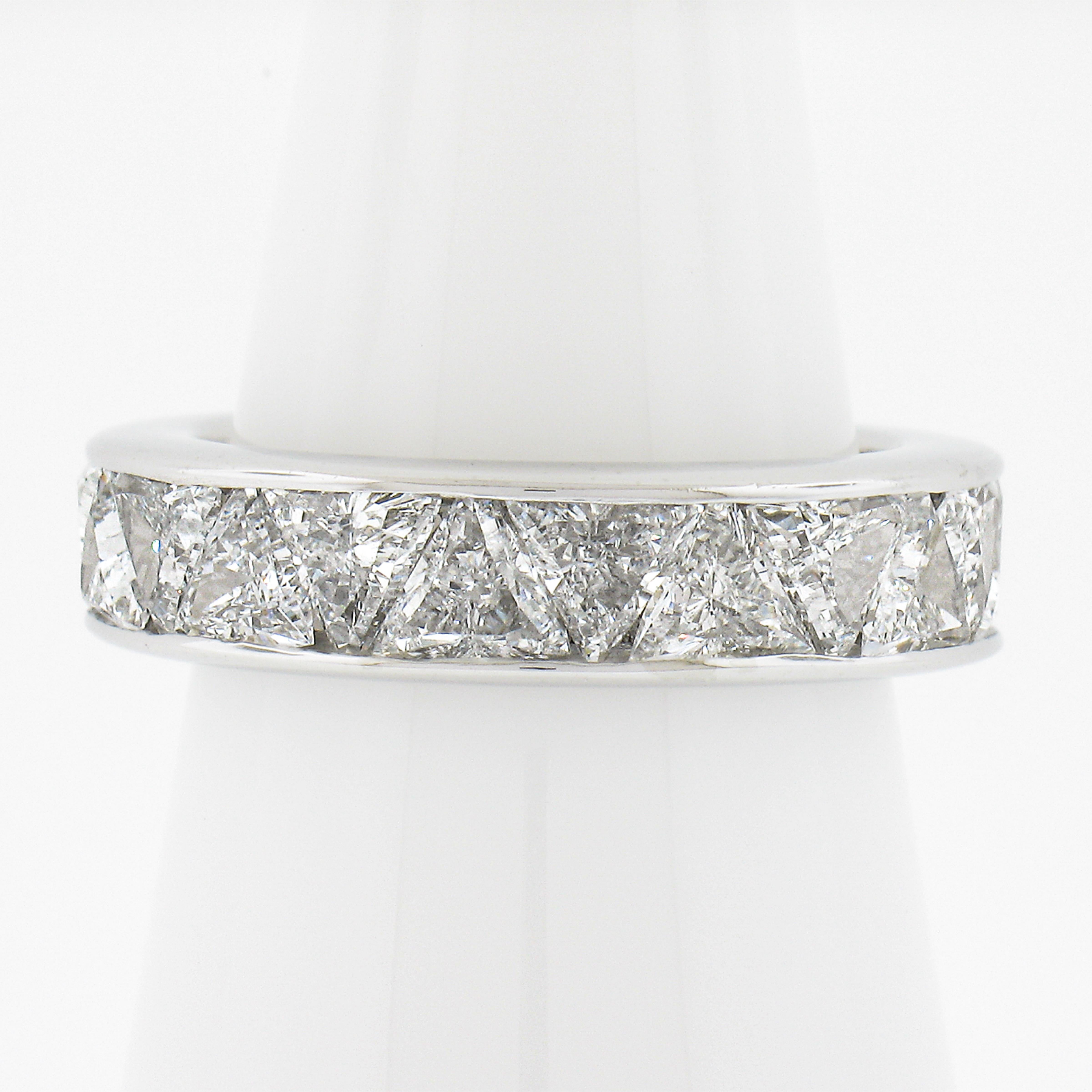 --Stone(s):--
(22) Natural Genuine Diamonds - Custom Trilliant Cut - Channel Set - F-H Color - VS1-SI1 Clarity
Total Carat Weight: 4.40 (approx.)

Material: Solid Platinum .900+
Weight: 9.23 Grams
Ring Size: 7.0 (We CANNOT custom size this