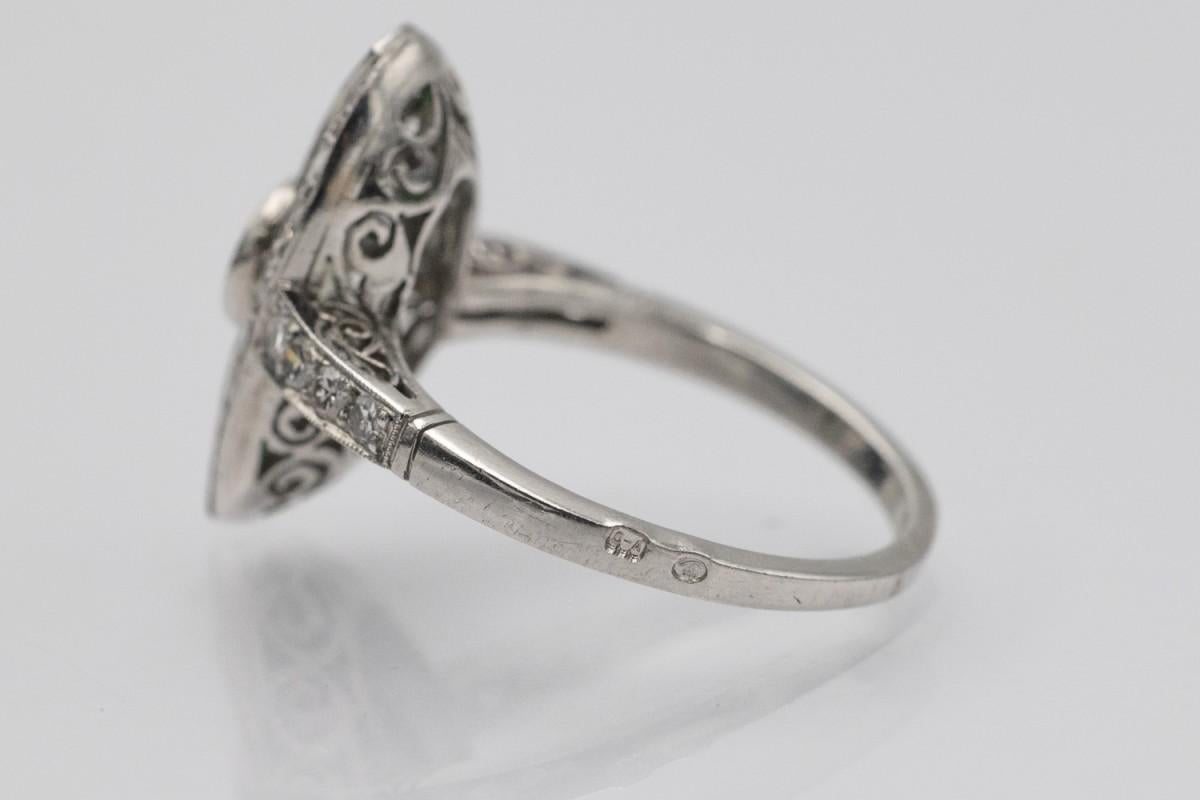 Unique platinum ring with diamonds, emeralds and onyxes in Art Deco style. For Sale 1