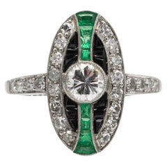 Unique platinum ring with diamonds, emeralds and onyxes in Art Deco style.