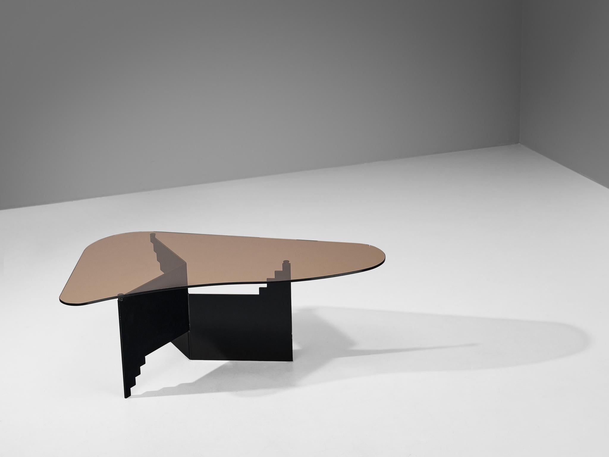 Coffee table, smoked glass, lacquered steel, Italy, 1970s.

This coffee table, which comes from Italy, is remarkably distinctive and visually appealing. The organic, free flowing edges of the tabletop contribute to an organic and natural