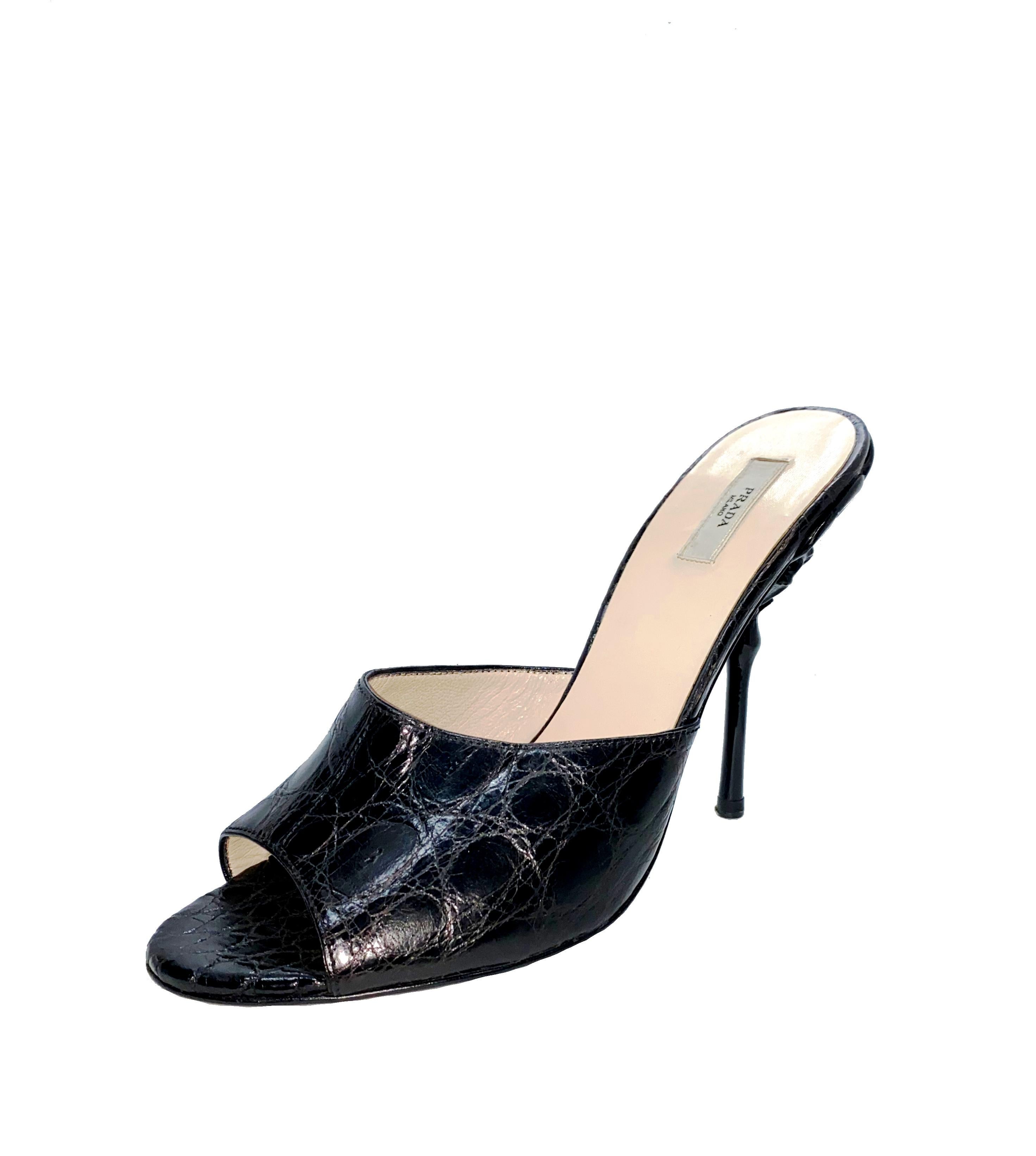 Beautiful Prada High Heel Sandals
Real crocodile skin in black color - no print
From Prada's exotic skin collection
The heel is in the shape of a flower
Made in Italy
Size 38 
Comes with Prada dustbag
Retailed for 2799$
