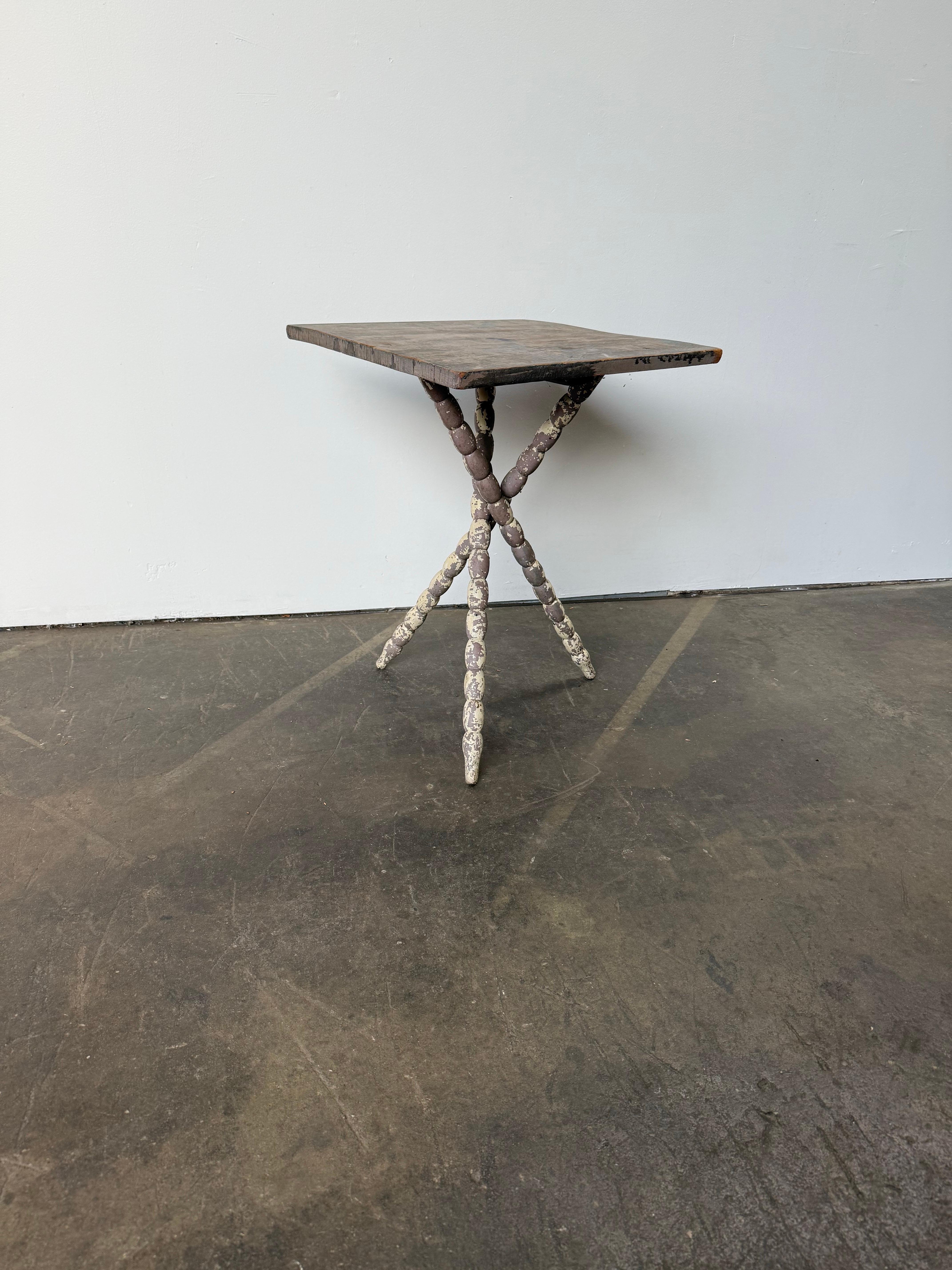 You’ve never seen a table like this. The shape, construction, carved legs, asymmetrical execution, and layers of different paint add up to the most superb unique side table the world has ever seen! Solid and sturdy, perfectly imperfect, this table