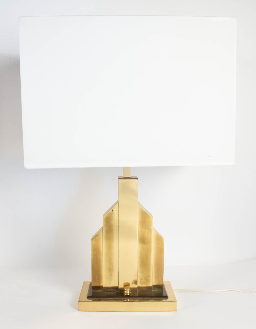 Unique rare pair of table lamps by Romeo Rega, gilded brass and bakelite, Italy, early 1970s.
There are several similar models of this pair, yet, the base of this pair is made of brass with a plate of black bakelite and original dimmer, which means