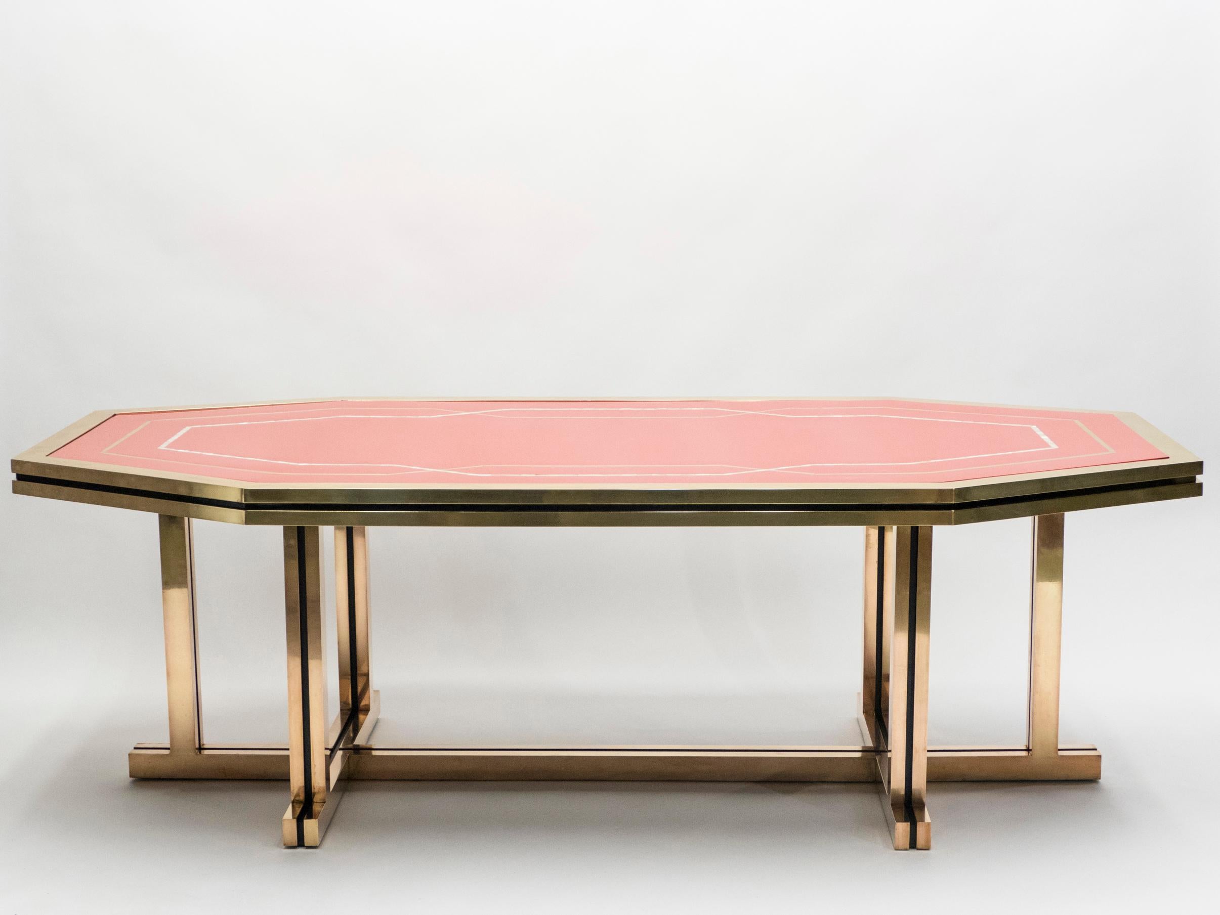 A rare piece from Maison Jansen, this large dining table was a commission by a private client. With its impeccable design, perfect proportions, and high-end materials like mother of pearl lacquer and brass, it was likely a hugely expensive