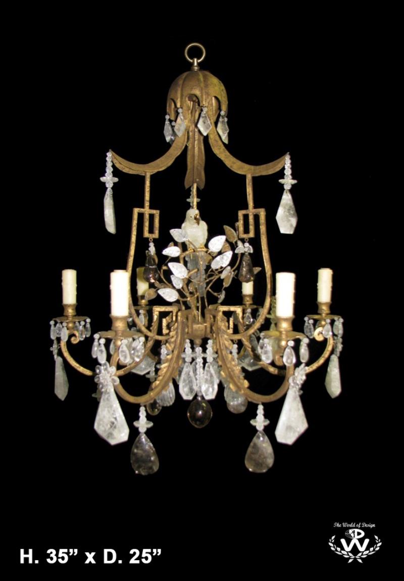 Fine Faberge Esque Rock Crystal 6 light chandelier, with finely carved rock crystal bird in the center.
In a Chippendale style hand forged wrought iron frame, enhanced with unique shaped prisms and meticulous attention is given to every details.