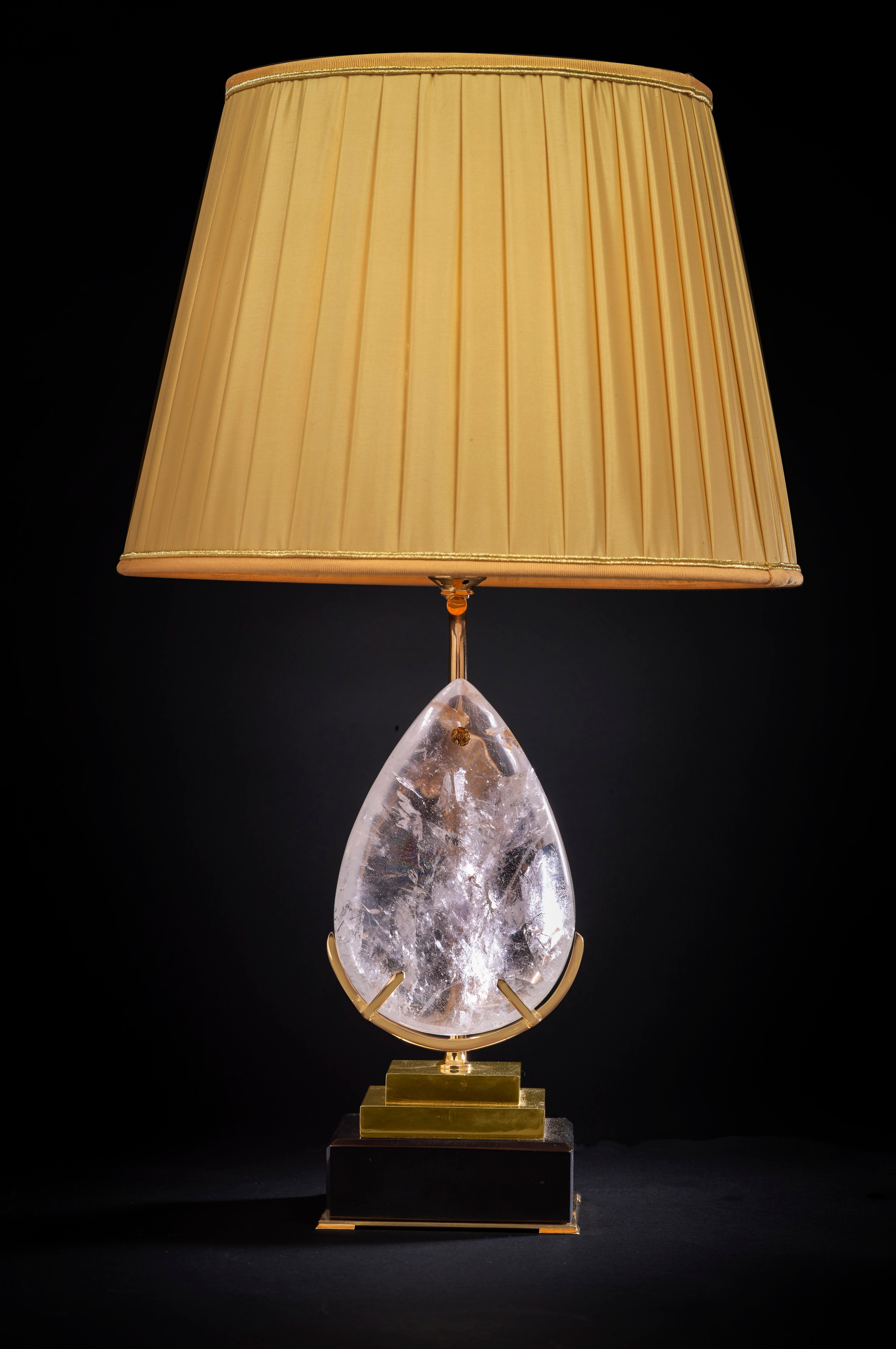 Belgian black marble lamp with an amazing big rock crystal pear.
24-karat ormolu gilding cover the brass steps.
Lampshade handmade and customized for this lamp.
Could be by request be made in a different color.
Unique piece.
Made in France.