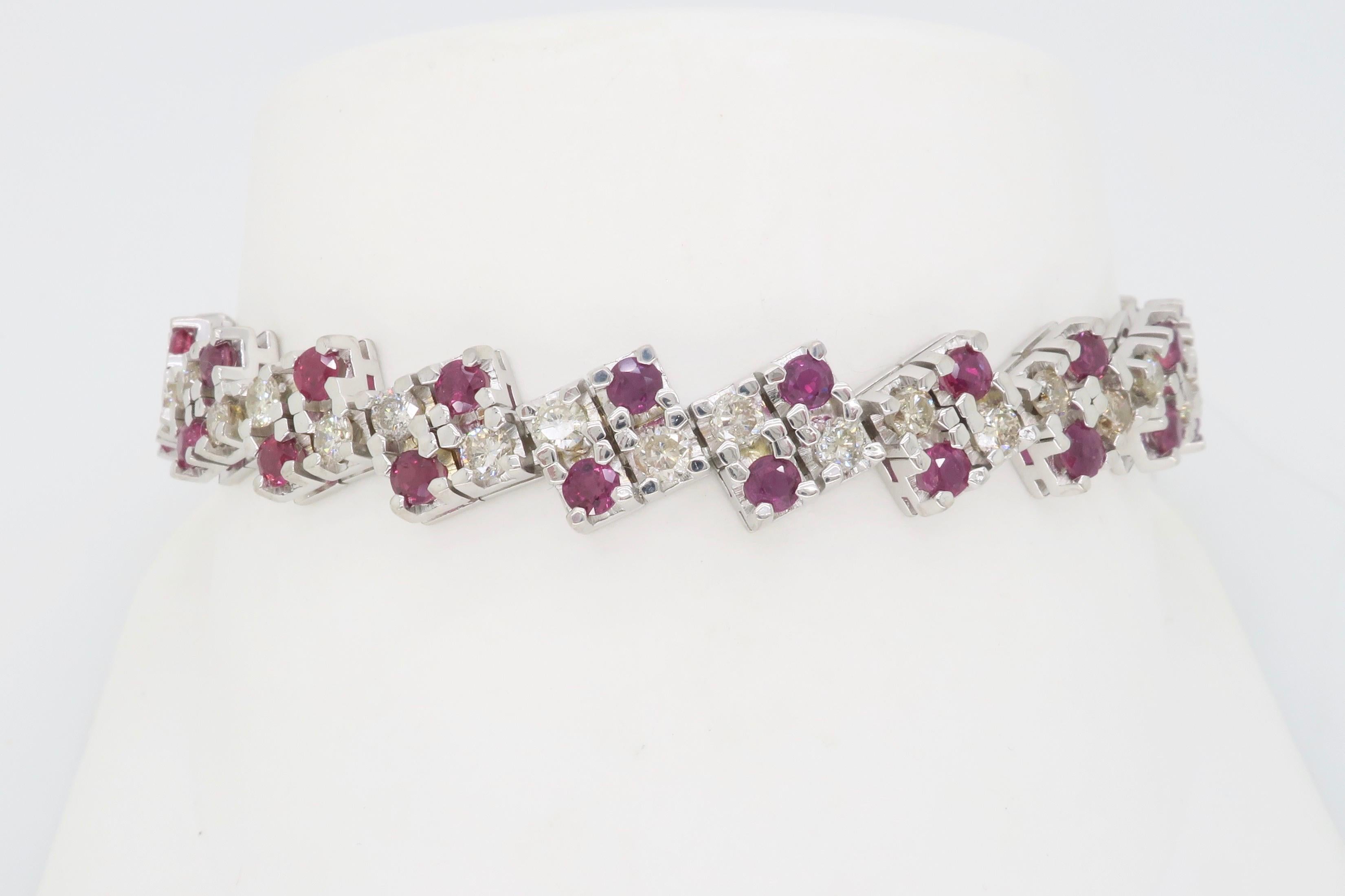 Unique ruby and diamond bracelet crafted in 14k white gold. 

Gemstone: Diamond and Ruby
Gemstone Weight: 41 Rubies measuring approximately 3mm each
Diamond Carat Weight: Approximately 3.25CTW
Diamond Cut: Round Brilliant Cut Diamonds
Color: Average