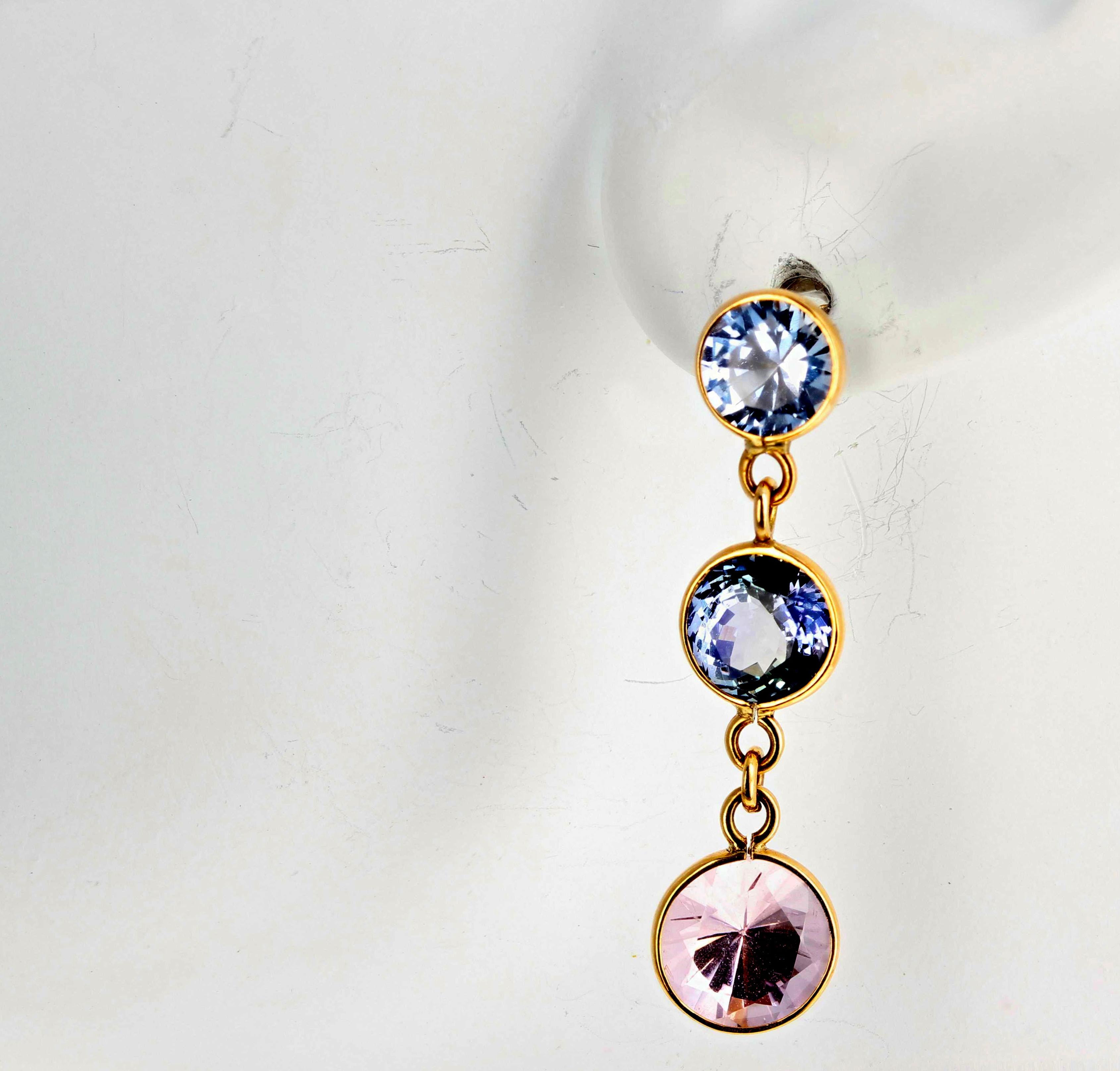 Glittering bluish white 1.70 carats of Sapphires (5 mm) top these beautiful blue Sapphires (2.84 carats - 6 mm)) and sparkling pink Morganites (2.88 carats- 7 mm)) set in handmade unique 18Kt yellow gold swinging stud earrings.  They glamorously