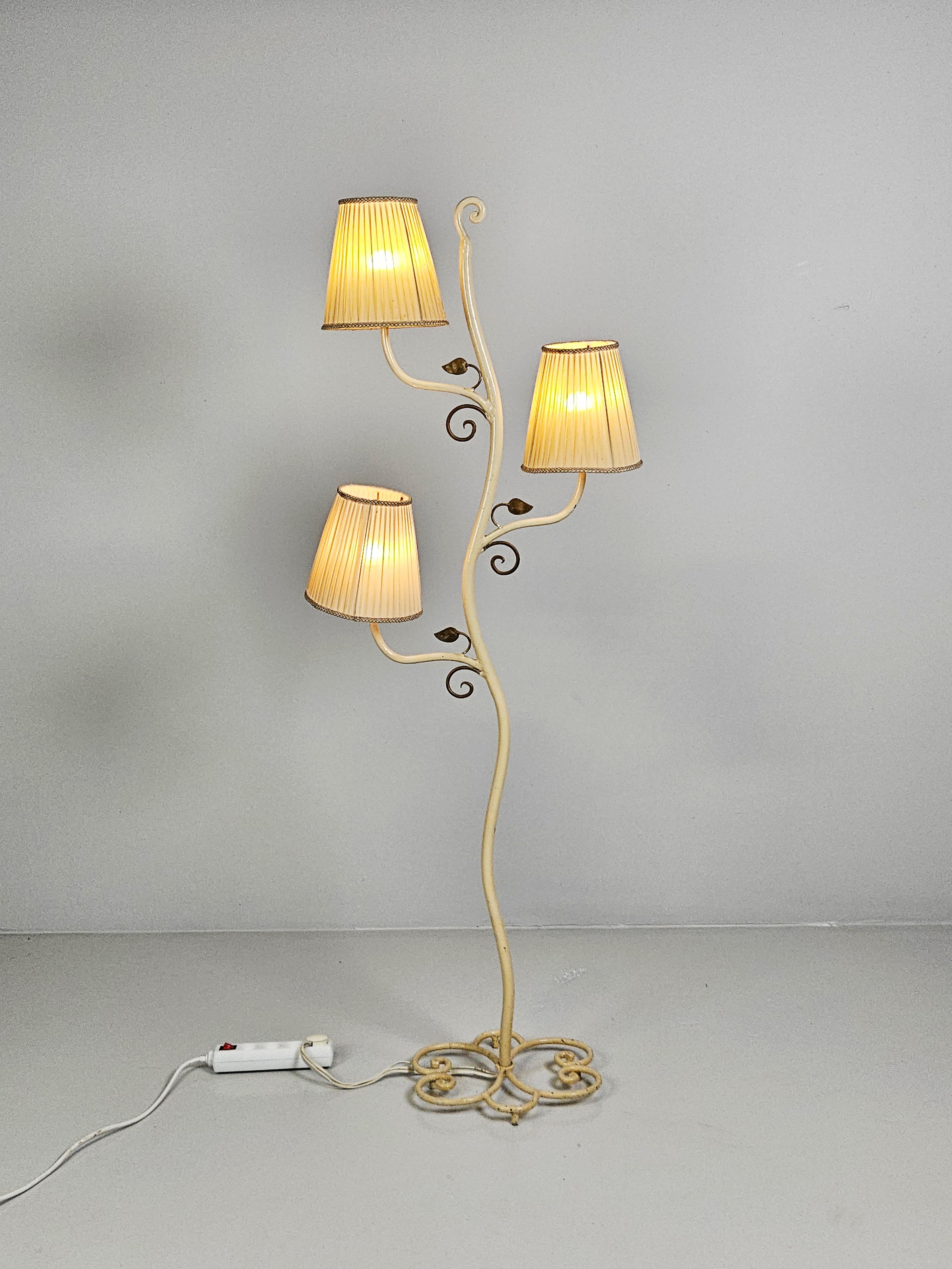 One of a kind floor lamp proberly produced by Bjerkås Armatur during the early part of the 20th century. 

Color is off white with leaves lacquered gold. 

Original shades are included but have holes and tares. 