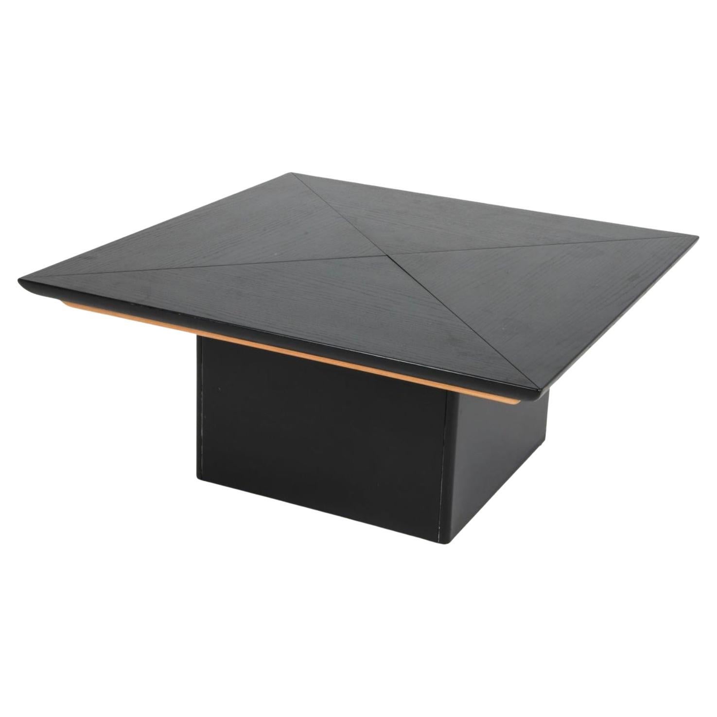 Unique Scandinavian Square Geometric Pine wood coffee table with four outward-moving triangular panels and a contrasting parquet hidden top surface. Made in Sweden circa 1970s. 

Dimensions: H 19